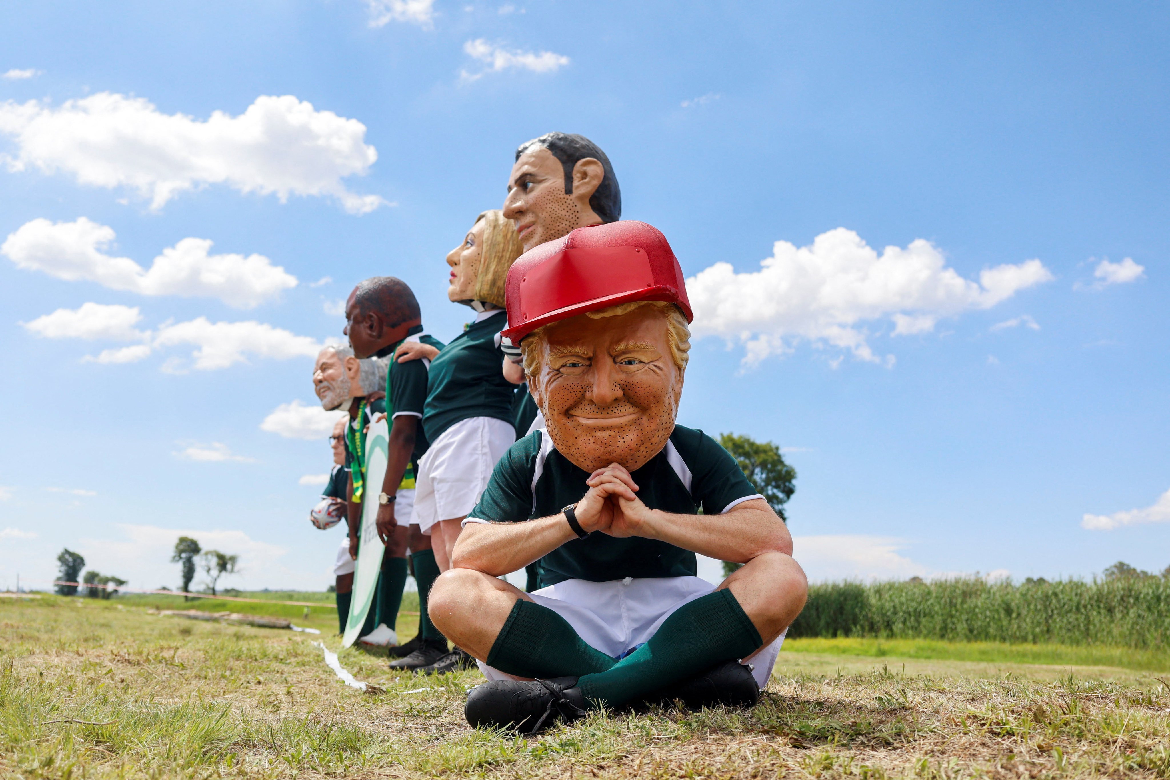 A protester wears a Trump mask, as Oxfam activists demanding the taxing of the super-rich in Johannesburg, South Africa, on Saturday, the opening day of the G20 leaders’ summit. Photo: Reuters
