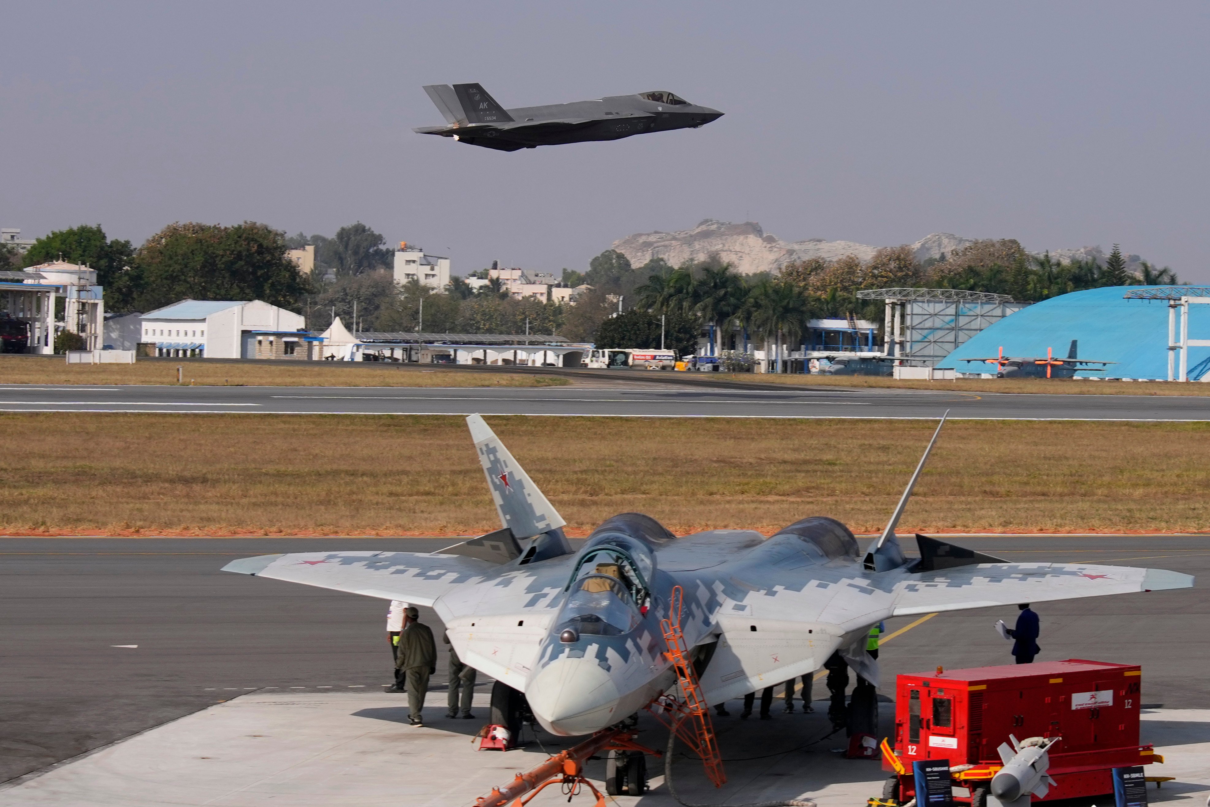 A US F-35 jet flies over Russia’s Su-57 fighter aircraft during an air show at Yelahanka airbase in Bengaluru, India, in February. Photo: AP