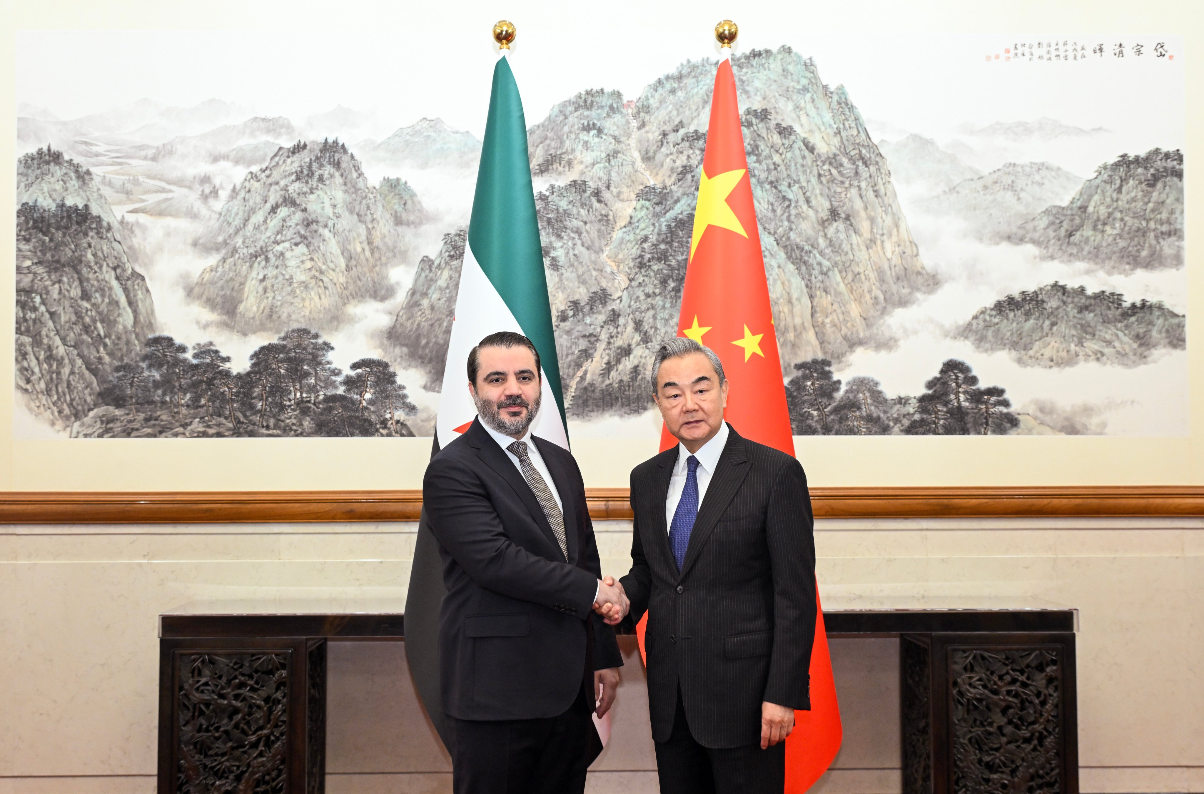 Chinese Foreign Minister Wang Yi with Syrian counterpart Asaad  al-Shaibani  ahead of their meeting in Beijing on November 17. Photo: Xinhua