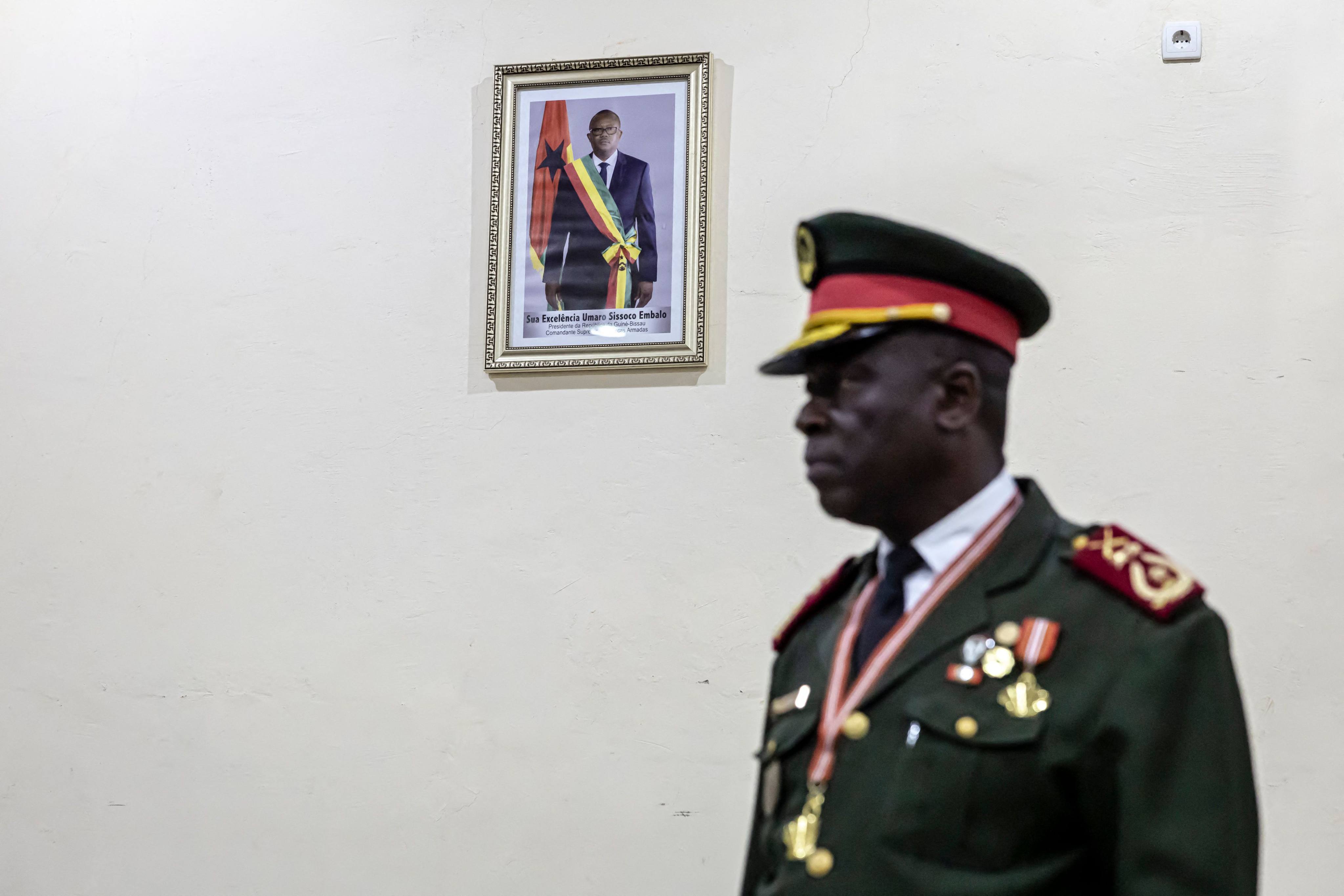 General Horta N’Tam next to a portrait of deposed President Umaro Sissoco Embalo, during his swearing-in ceremony as the head of Guinea-Bissau’s military government. Photo: AFP