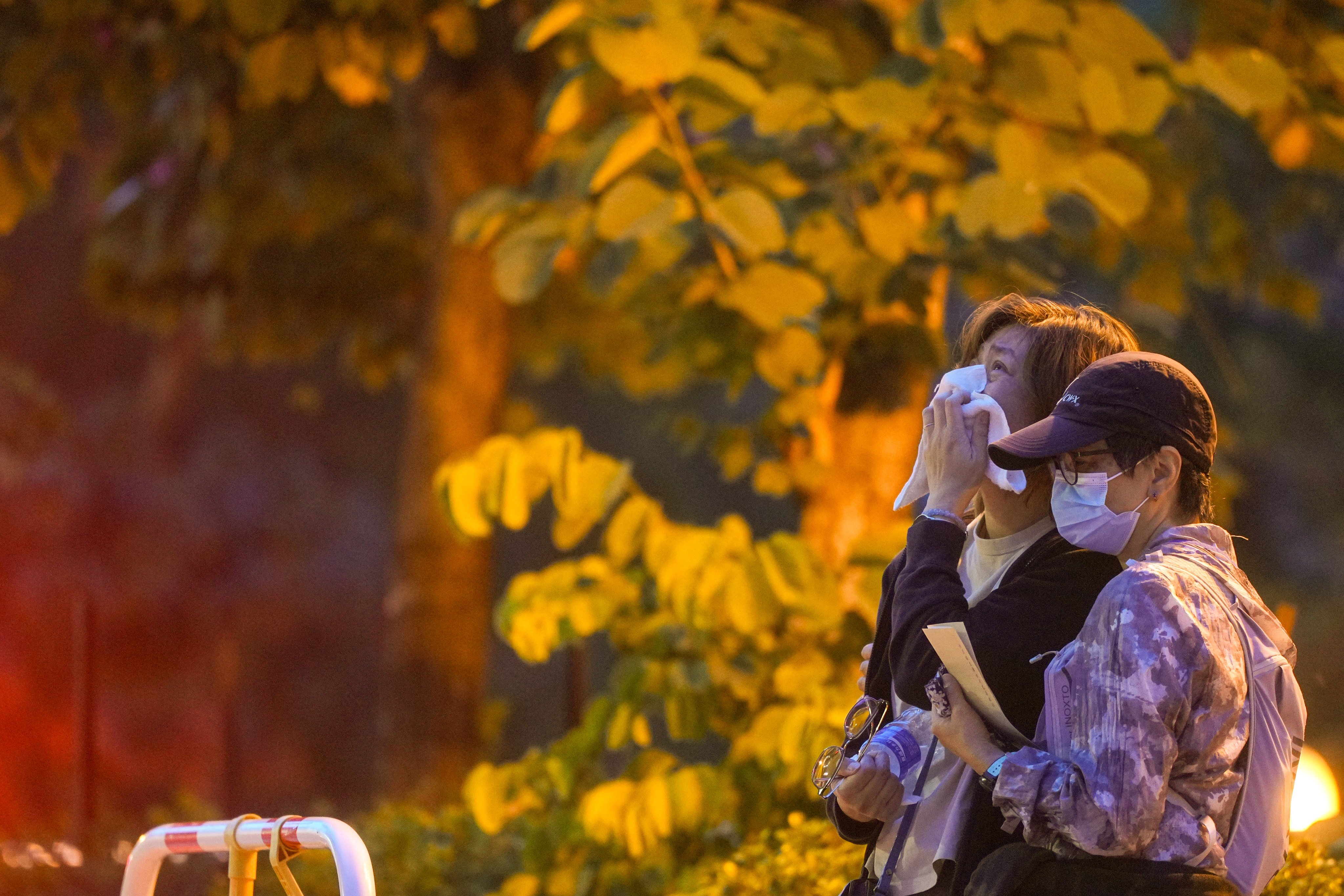 Relatives weep after identifying their deceased loved ones. Photo: Sam Tsang