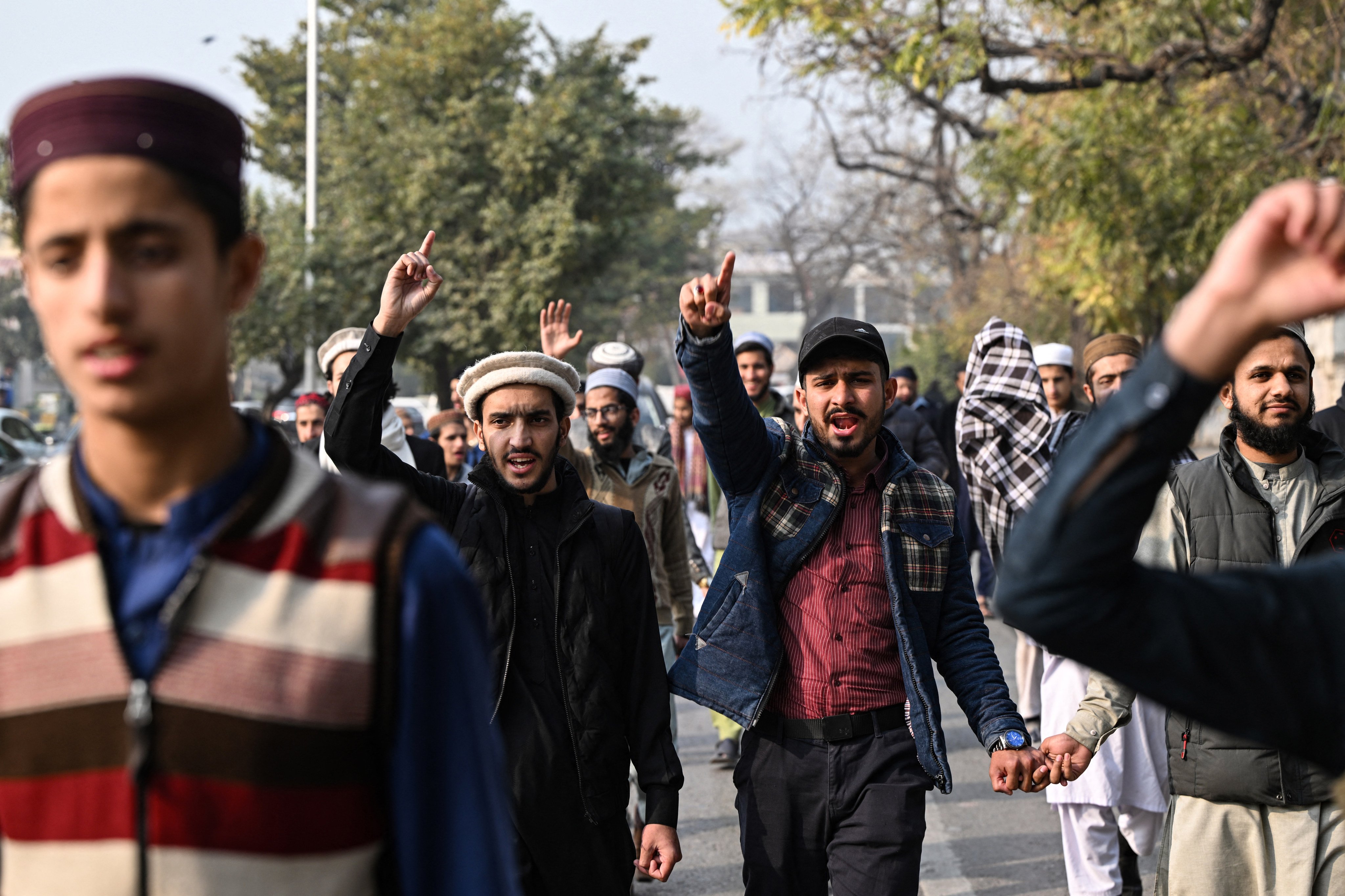 Young Pakistanis shout slogans during a protest in Islamabad last year. Photo: AFP