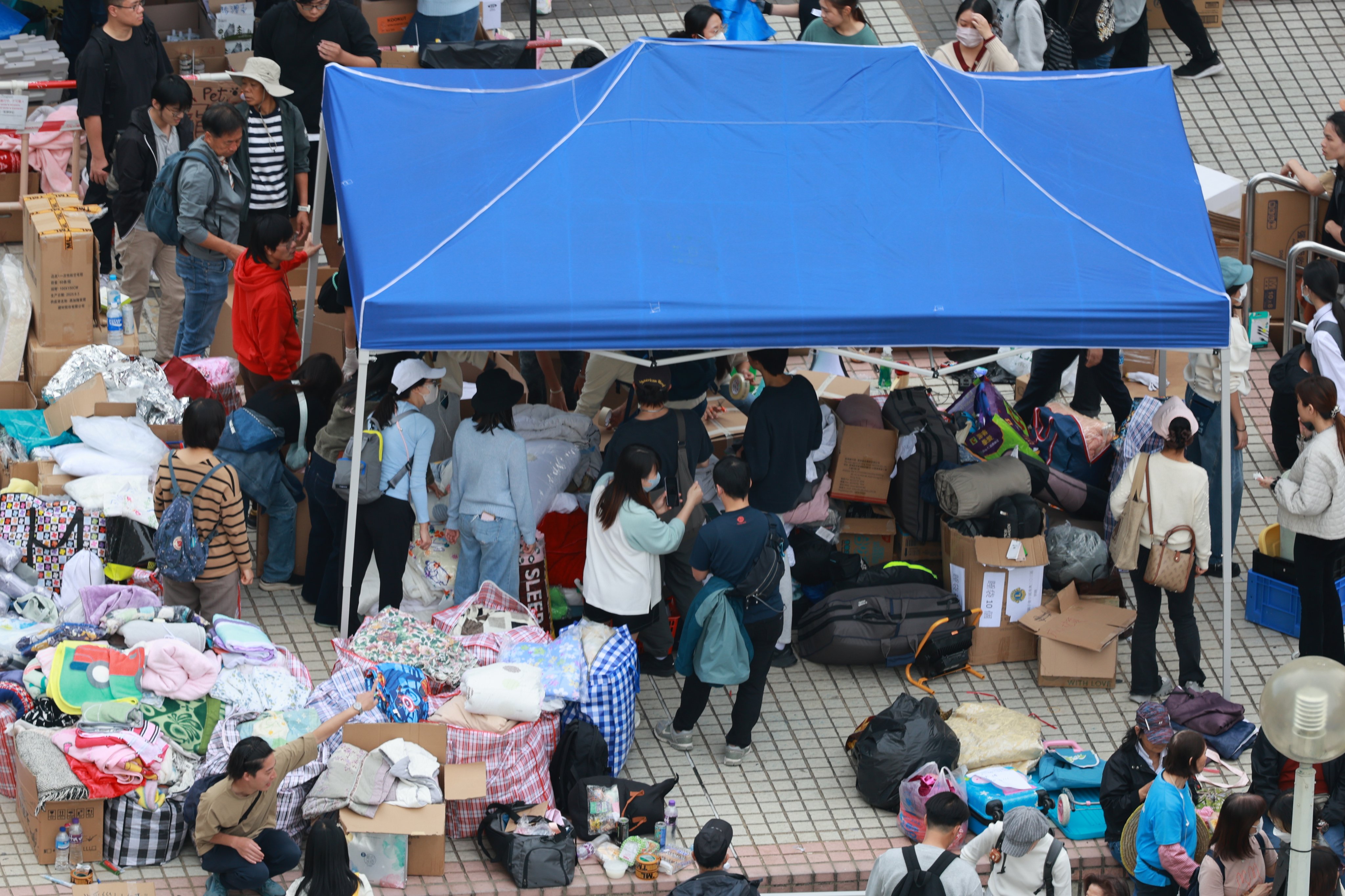 Volunteers organise aid distribution for residents affected by the Tai Po apartment fire in Hong Kong on November 28. Photo: EPA