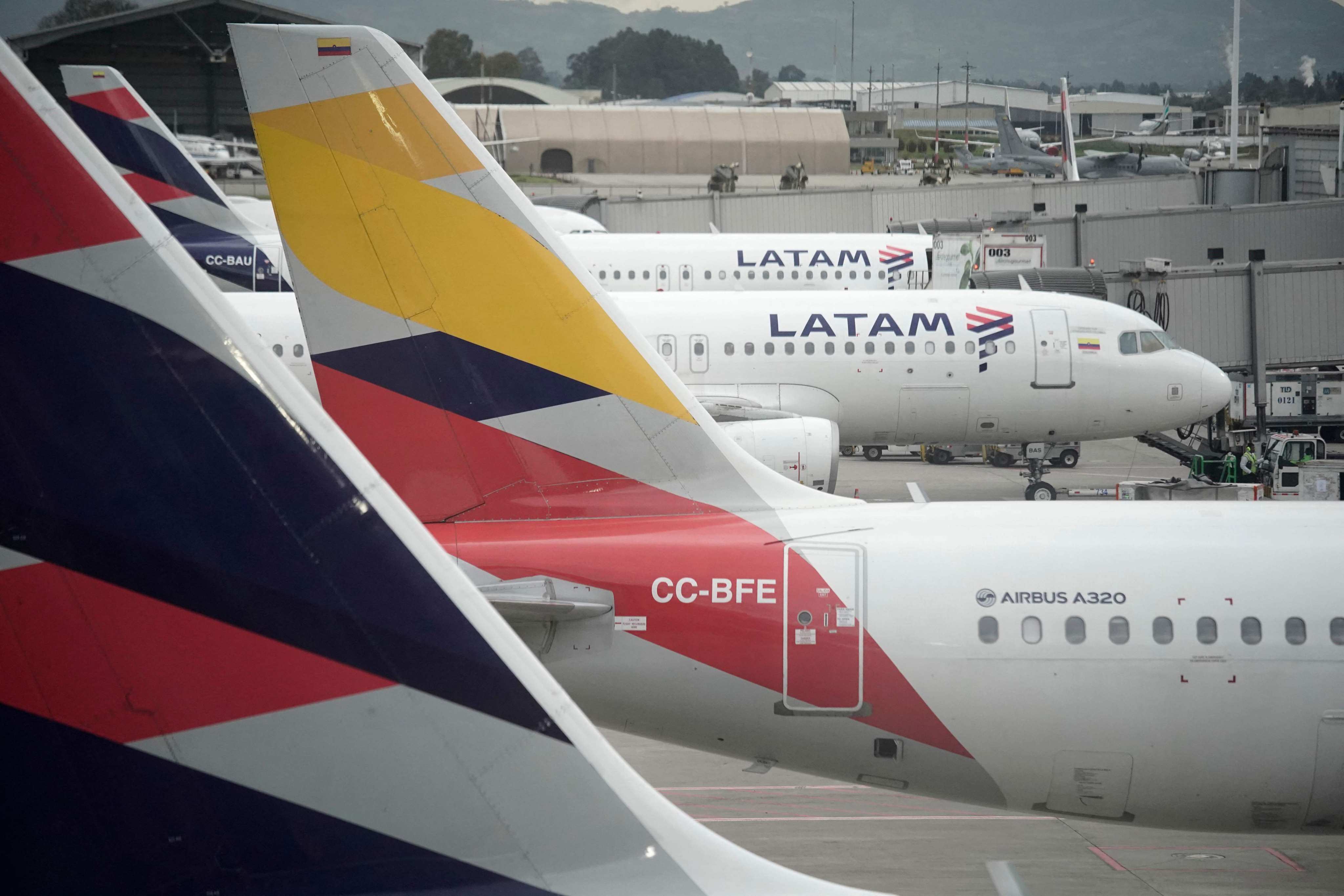Latam Airlines planes sit on the tarmac in Bogota, Colombia on Friday. Several other airlines have also cancelled flights in recent days following a security alert issued by the United States related to Venezuela. Photo: AFP