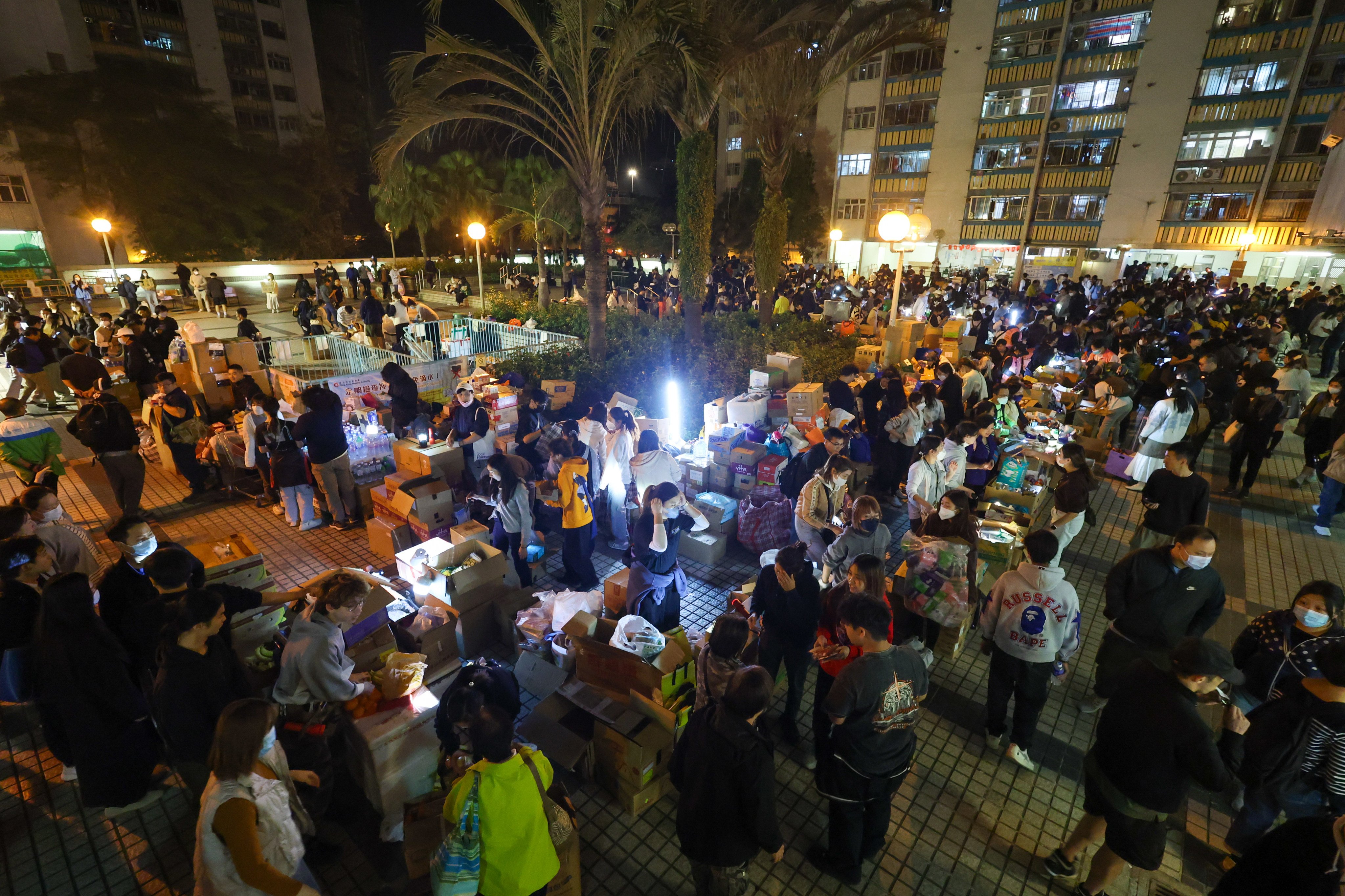 Volunteers quickly set up supply stations at the nearby Kwong Fuk Estate. Photo: Dickson Lee