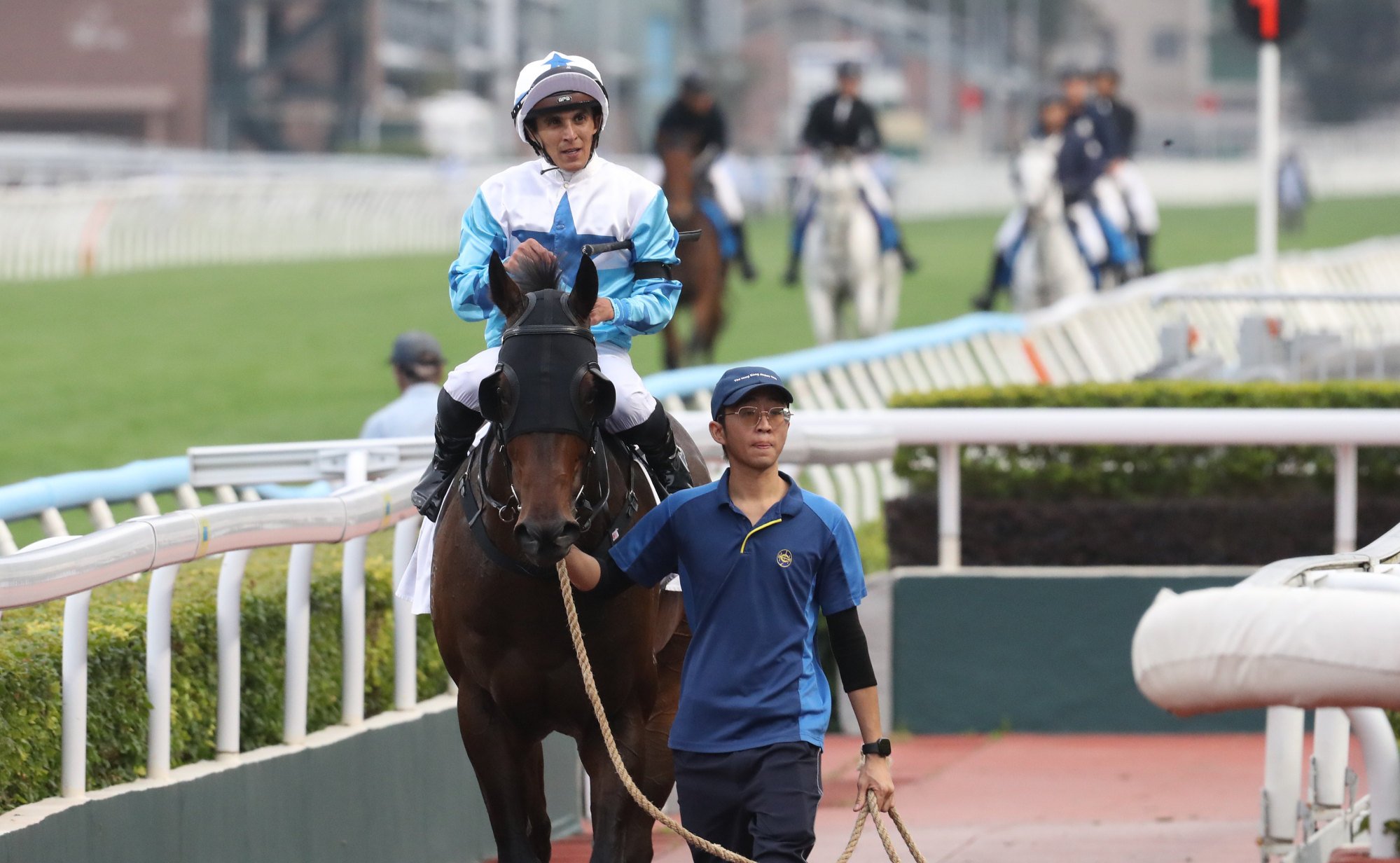 Keagan de Melo comes in after his final ride of his Hong Kong stint aboard Baby Crystal.