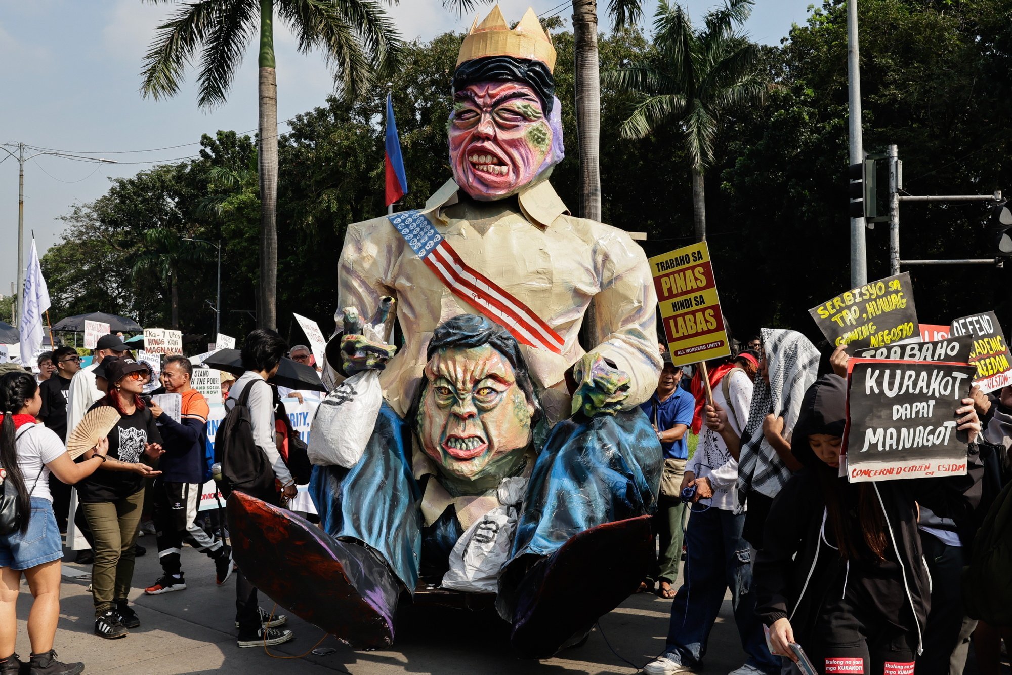 Protesters display an effigy of Philippine President Ferdinand Marcos Jnr and Vice-President Sara Duterte-Carpio during an anti-corruption rally in Manila on Sunday. Photo: EPA