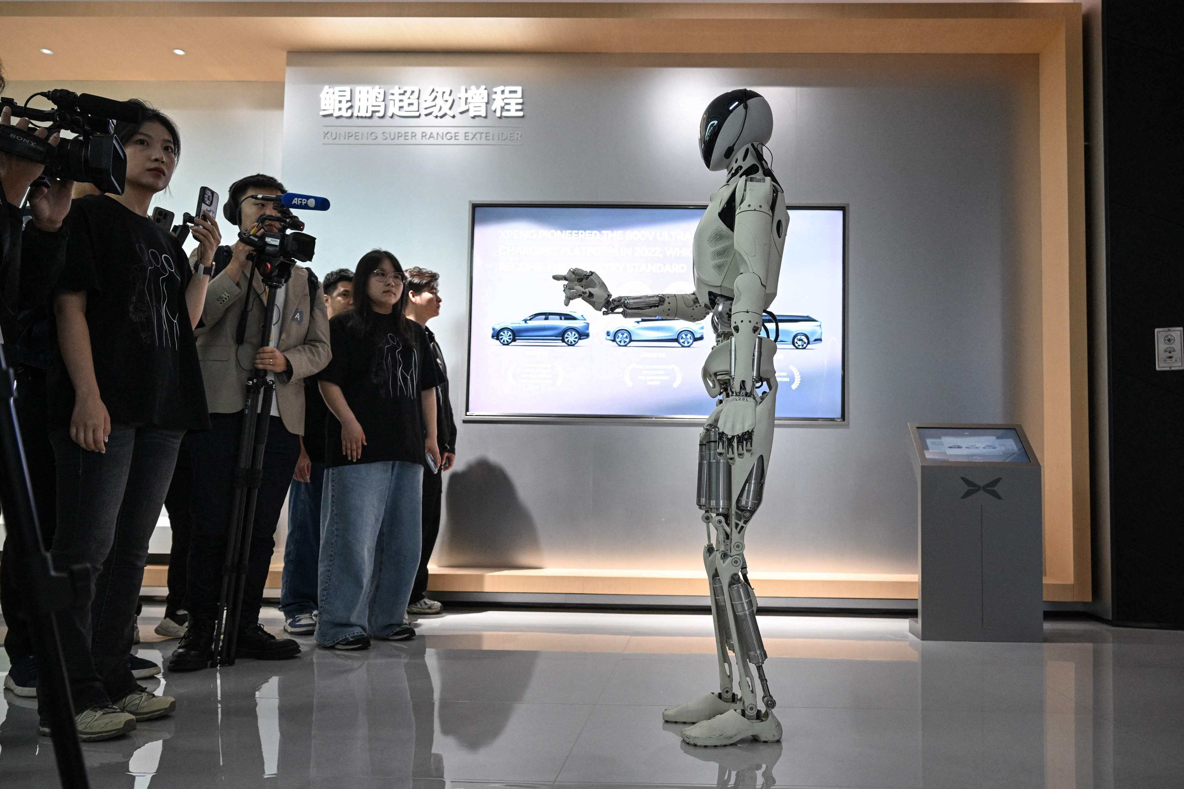 Xpeng’s next-generation Iron humanoid robot interacts with the media during a tour of the company’s headquarters in Guangzhou last month. Photo: AFP