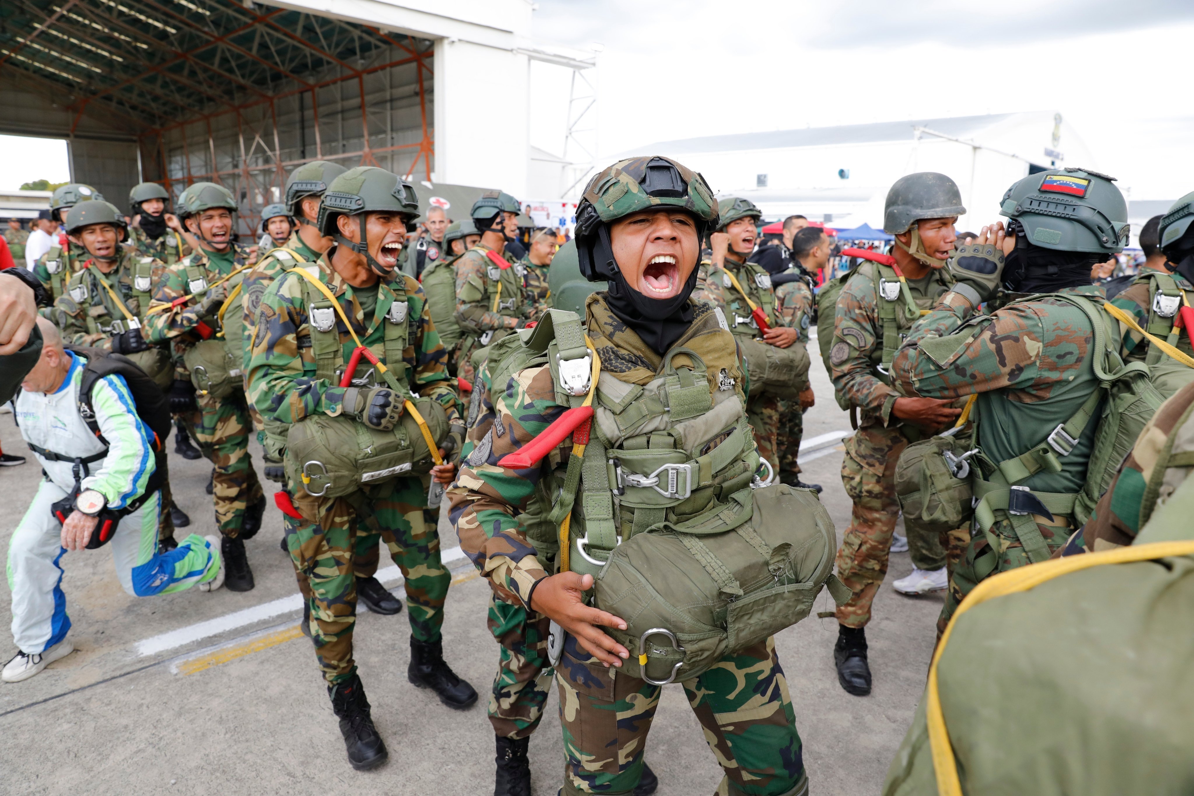 Skydivers get revved to perform in the Industrial Aviation Expo in Maracay, Venezuela on Saturday. Photo: AP