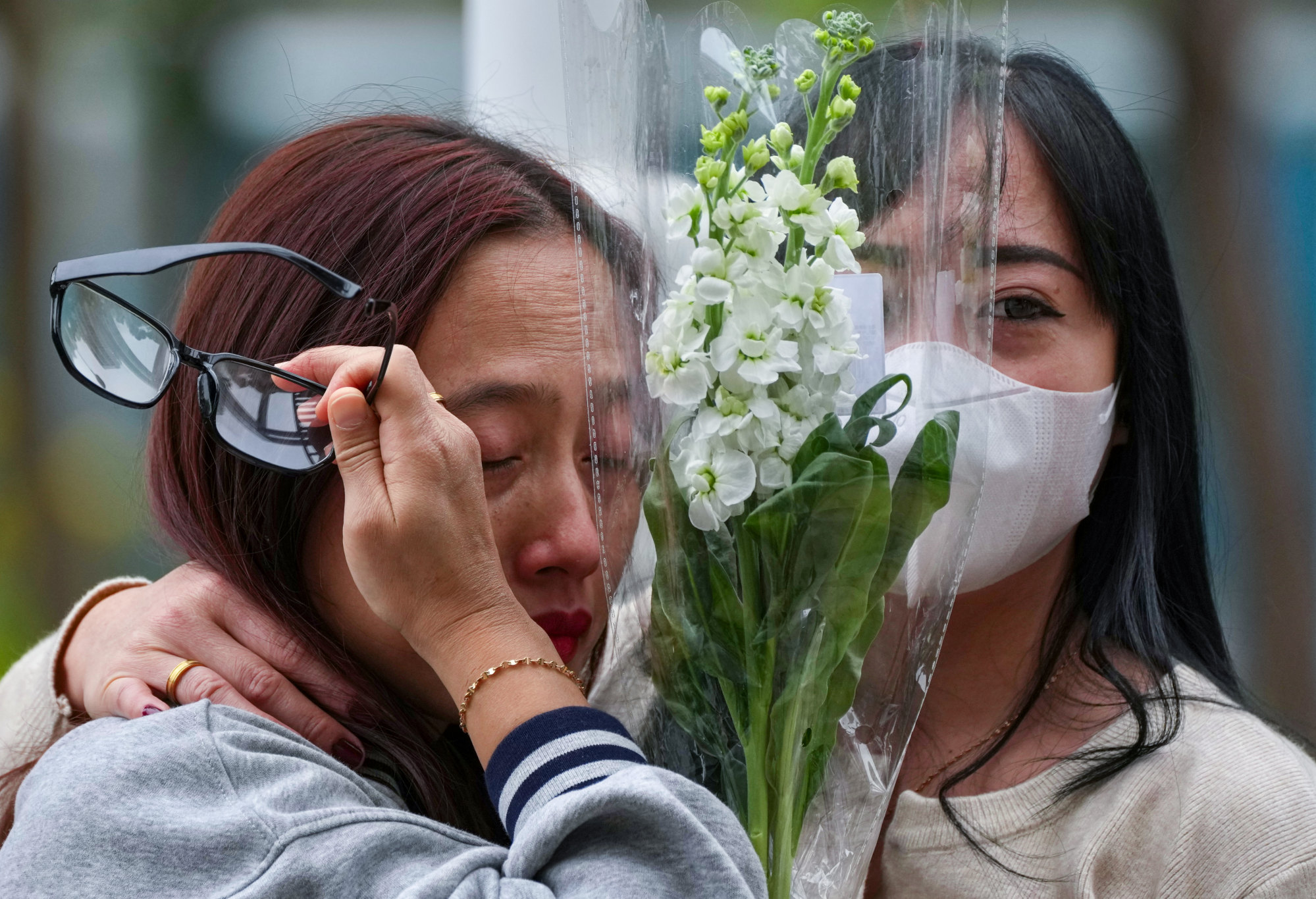 Mourners are overcome with emotion. Photo: Karma Lo