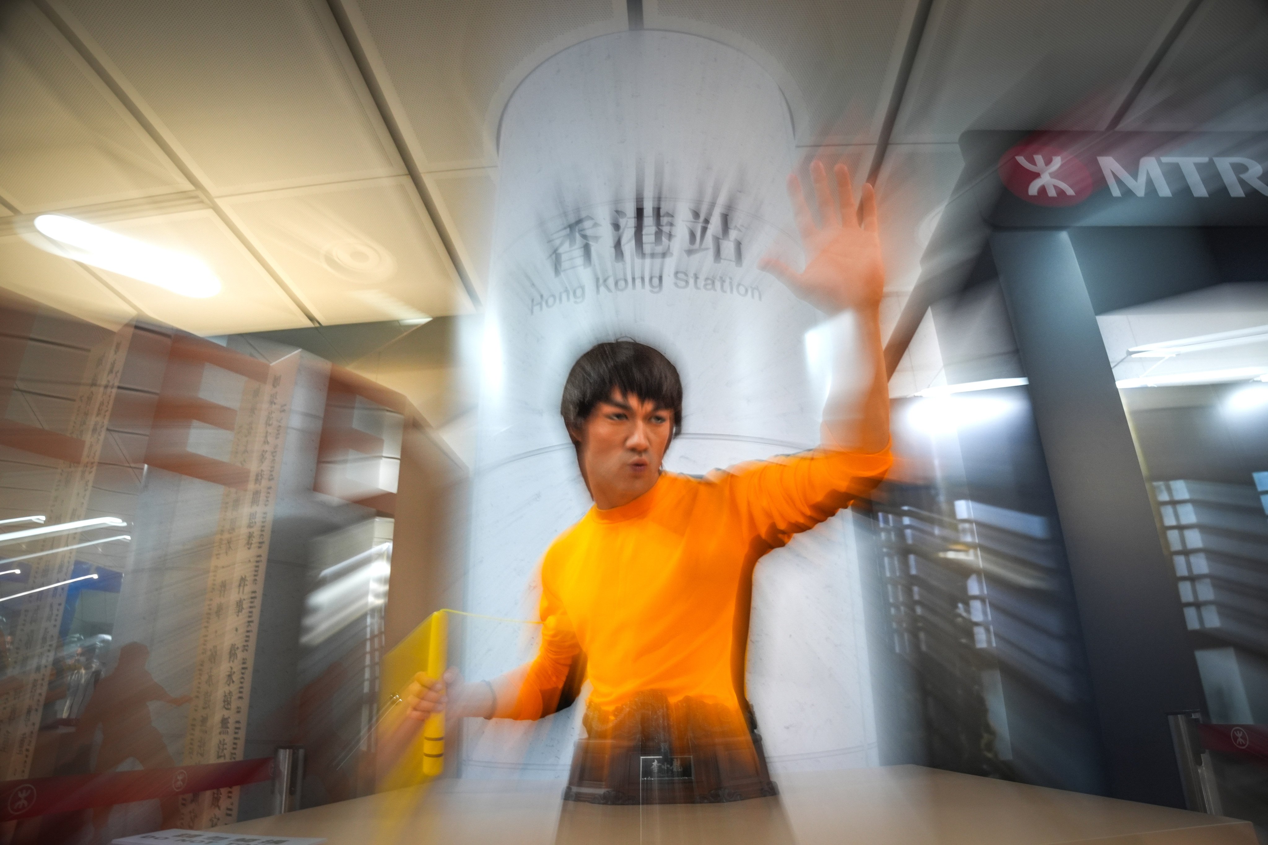 A Bruce Lee sculpture is showcased at “The Formless Way: Memorialising 85 years since Bruce Lee’s birth”, in Hong Kong Station on November 25. Photo: Eugene Lee