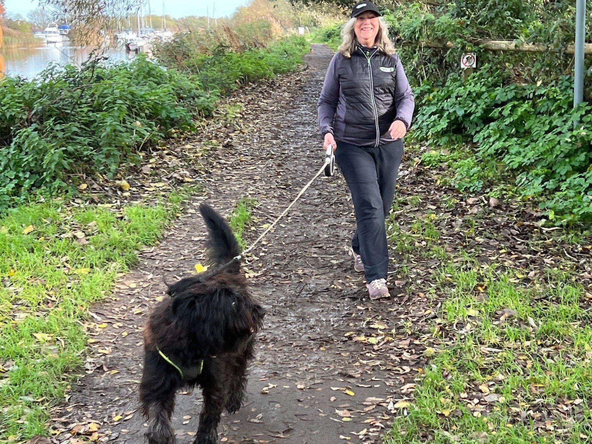 Sports therapist Gill Stewart walks with her dog Bessie. Walking - and physical activity in general - slows the accumulation in the brain of tau, a protein closely tied to the memory decline seen in Alzheimer’s. Photo: Gill Stewart