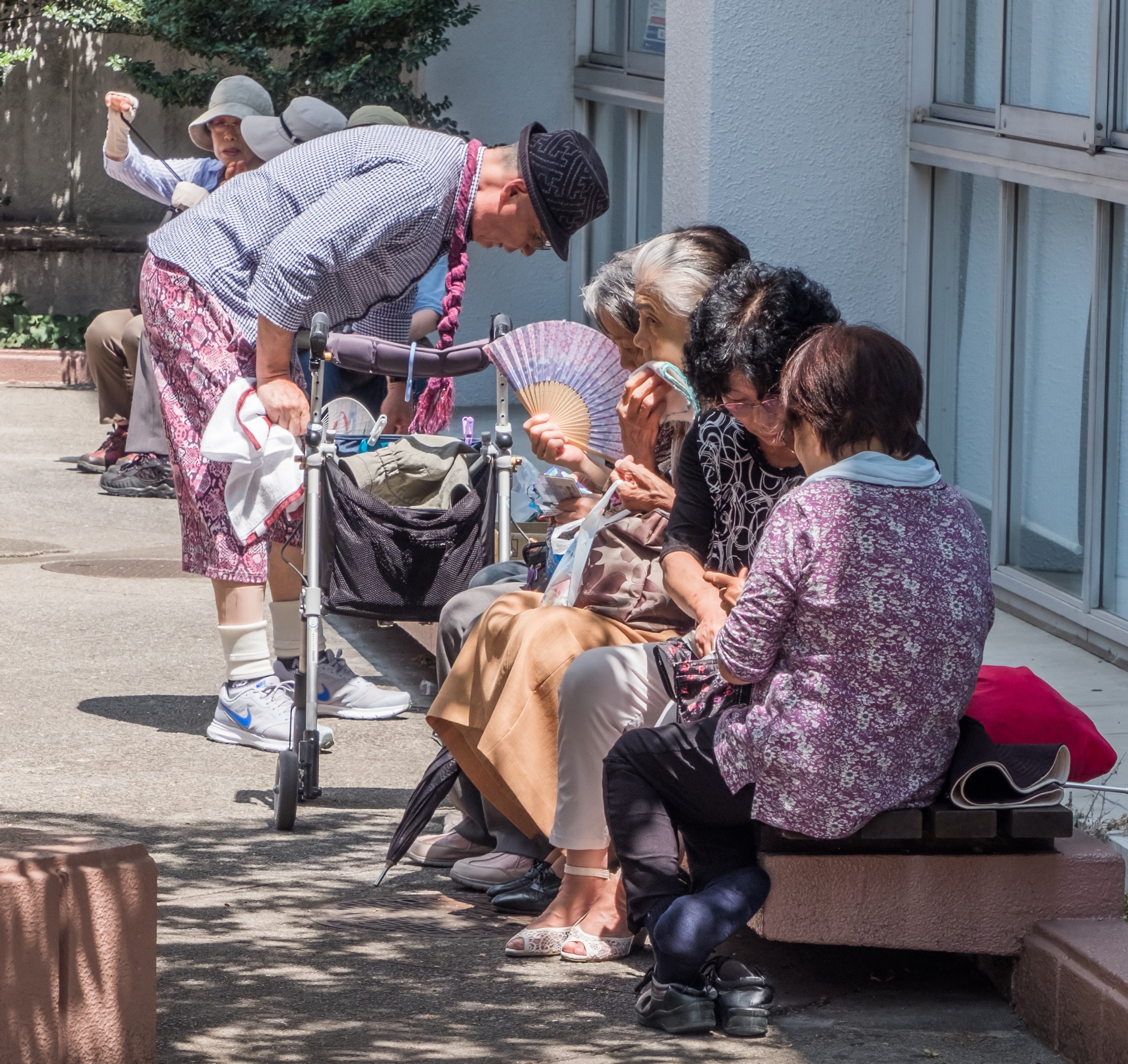 Elderly people at the Sugamo Jizodori shopping street in Tokyo. Photo: Shutterstock