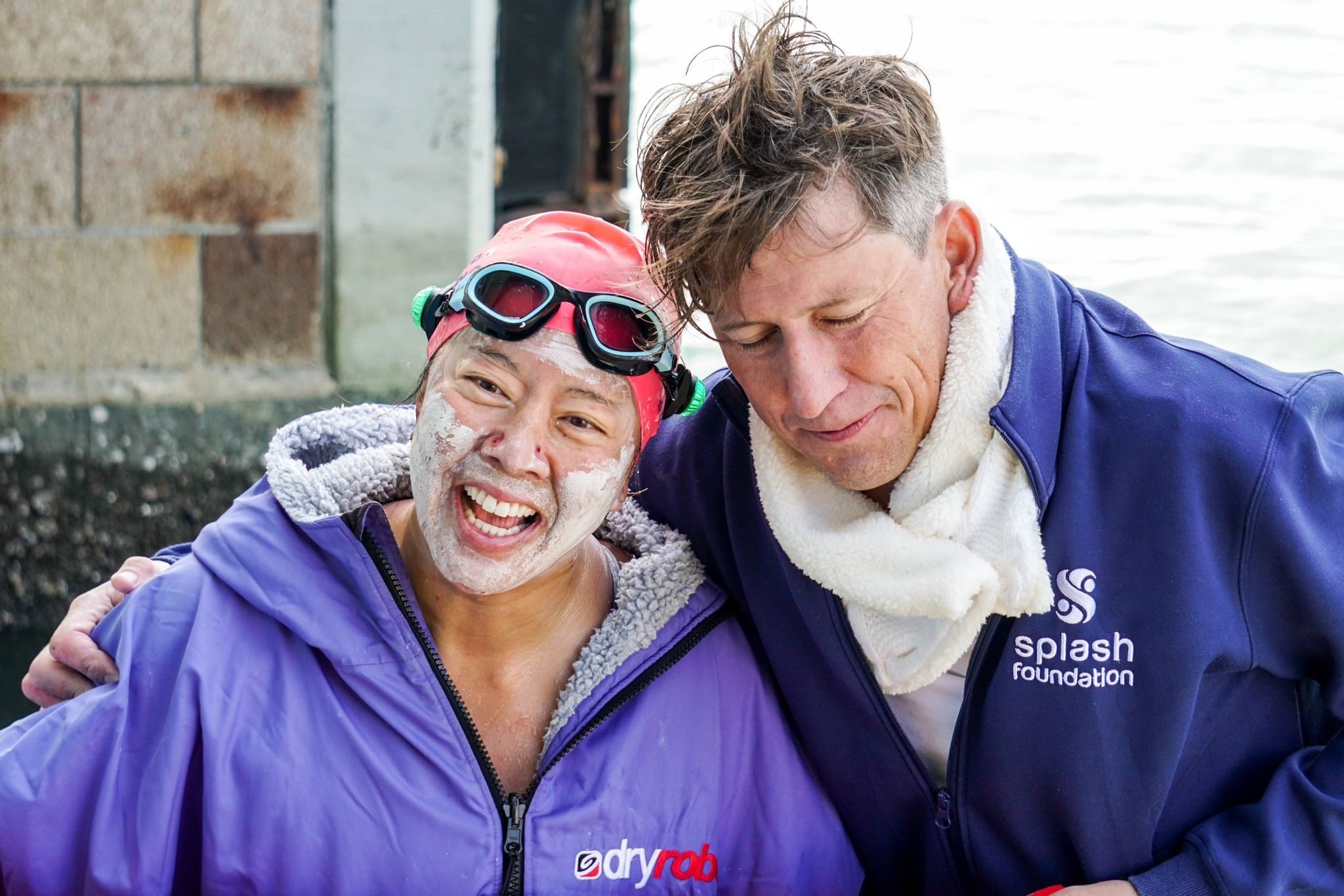 An elated Edie Hu shares an embrace with her open water swimming partner Simon Holliday after the two completed a 65km circumnavigation of Lantau Island on November 20, 2025 - a world’s first. Photo: Amy Miao