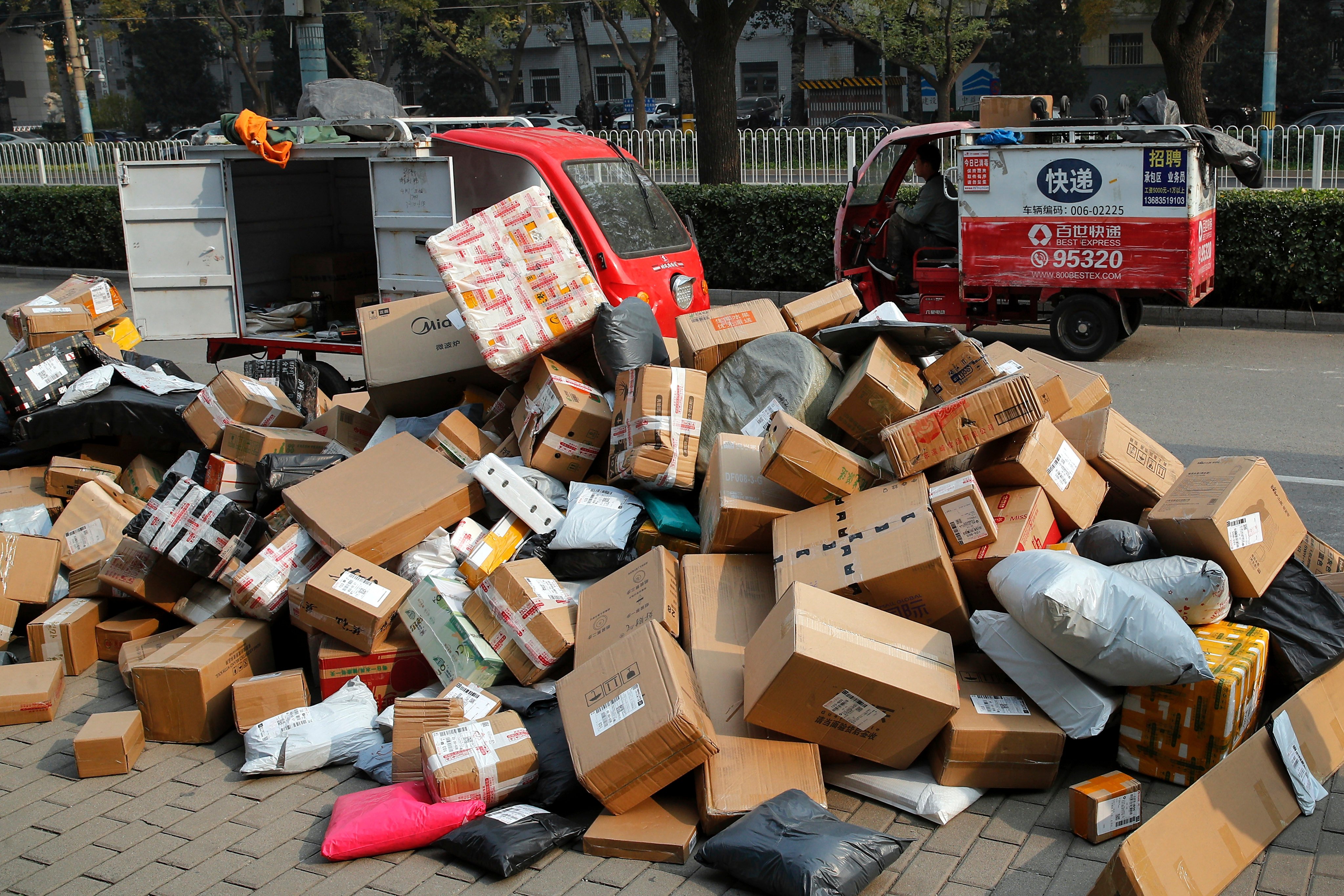 Parcels are piled up near an apartment building in Beijing during the Singles’ Day shopping festival in November 2020. China’s consumers continue to turn to e-commerce platforms to find cut-price deals. Photo: AP