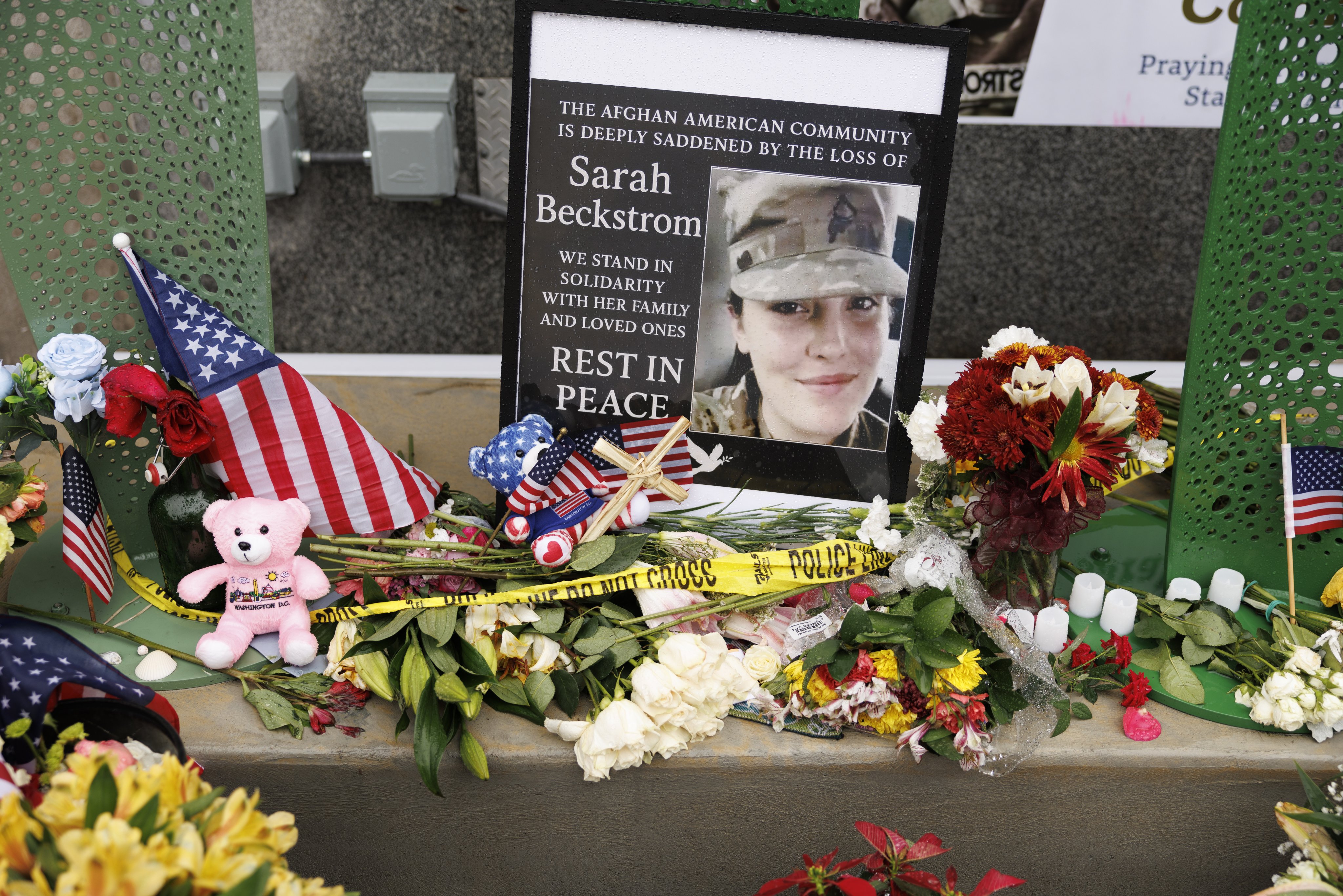 Tributes are seen on Tuesday at the scene where two National Guard members were shot in Washington. Photo: EPA