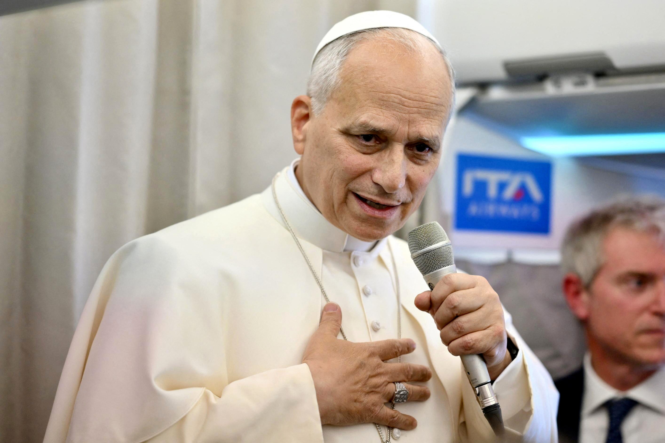Pope Leo speaks to journalists aboard a flight to Rome on Tuesday. Photo: AFP