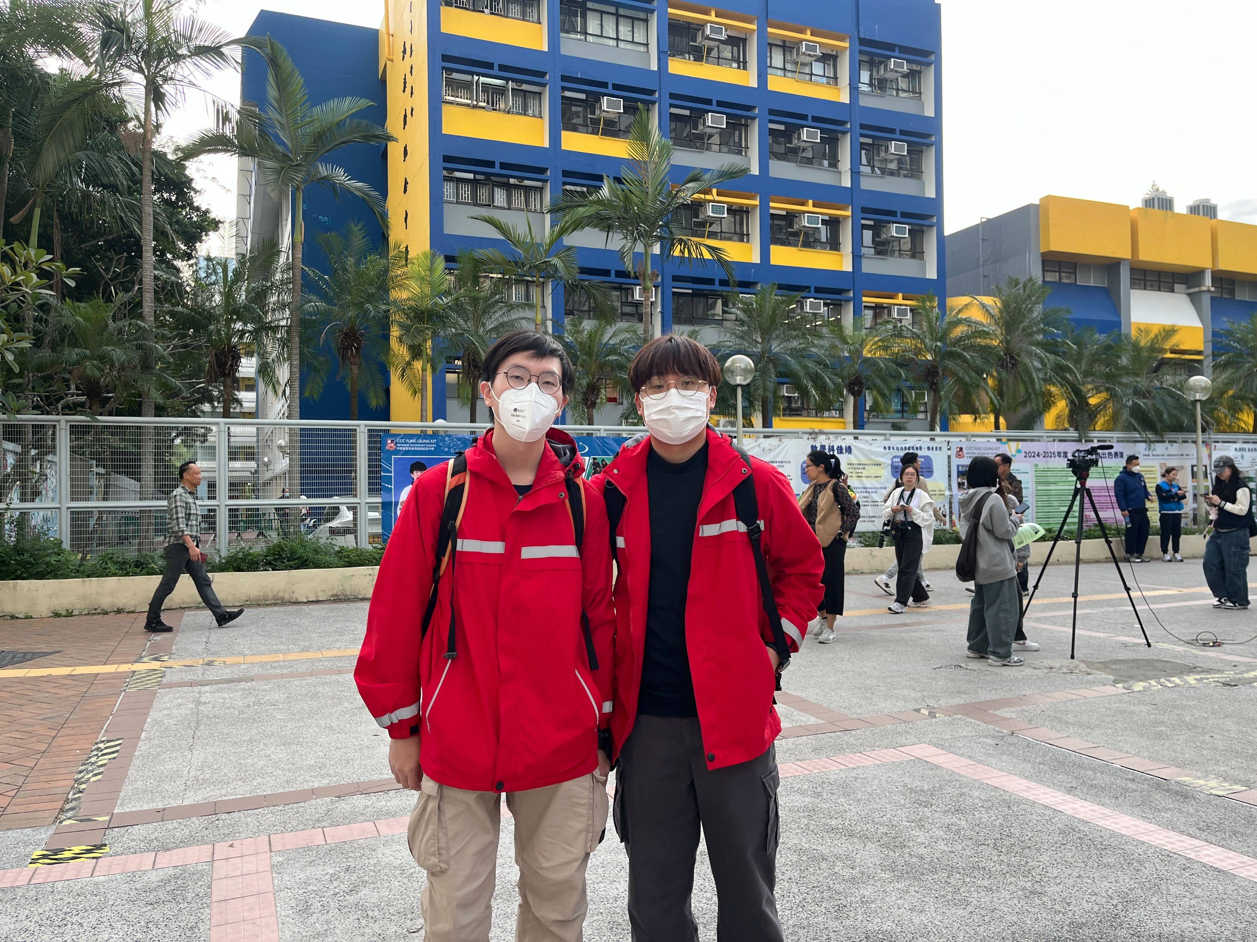 Todd Hu (left) and Alphon Fung are volunteers who helped victims of the Tai Po fire tragedy. Photo: Kelly Fung