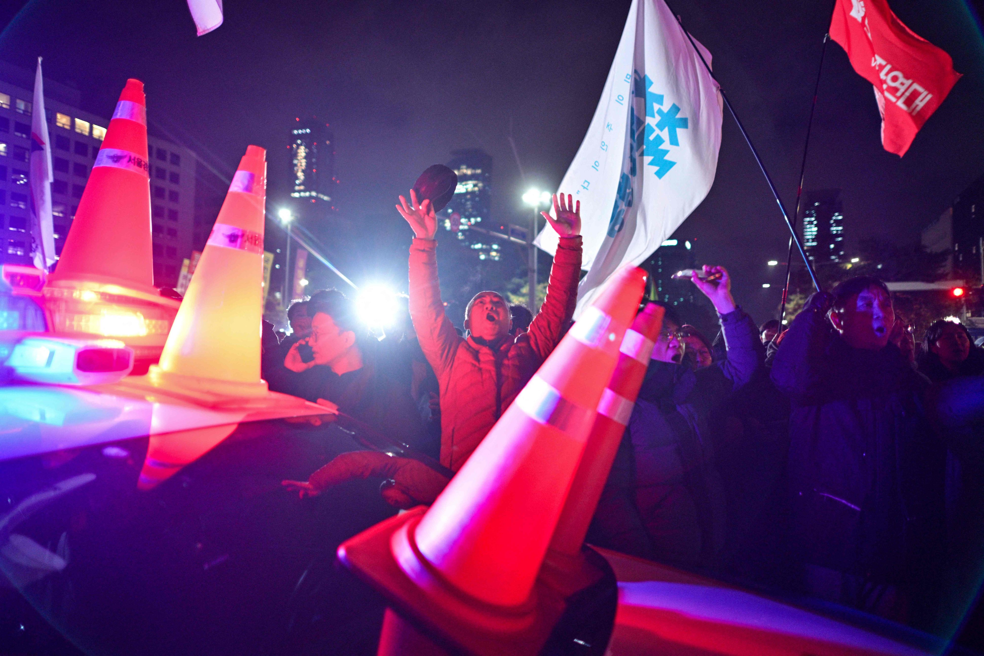 People gather outside the National Assembly in Seoul in the early morning of December 4, 2024, after then South Korea president Yoon Suk-yeol had declared martial law. Photo: AFP