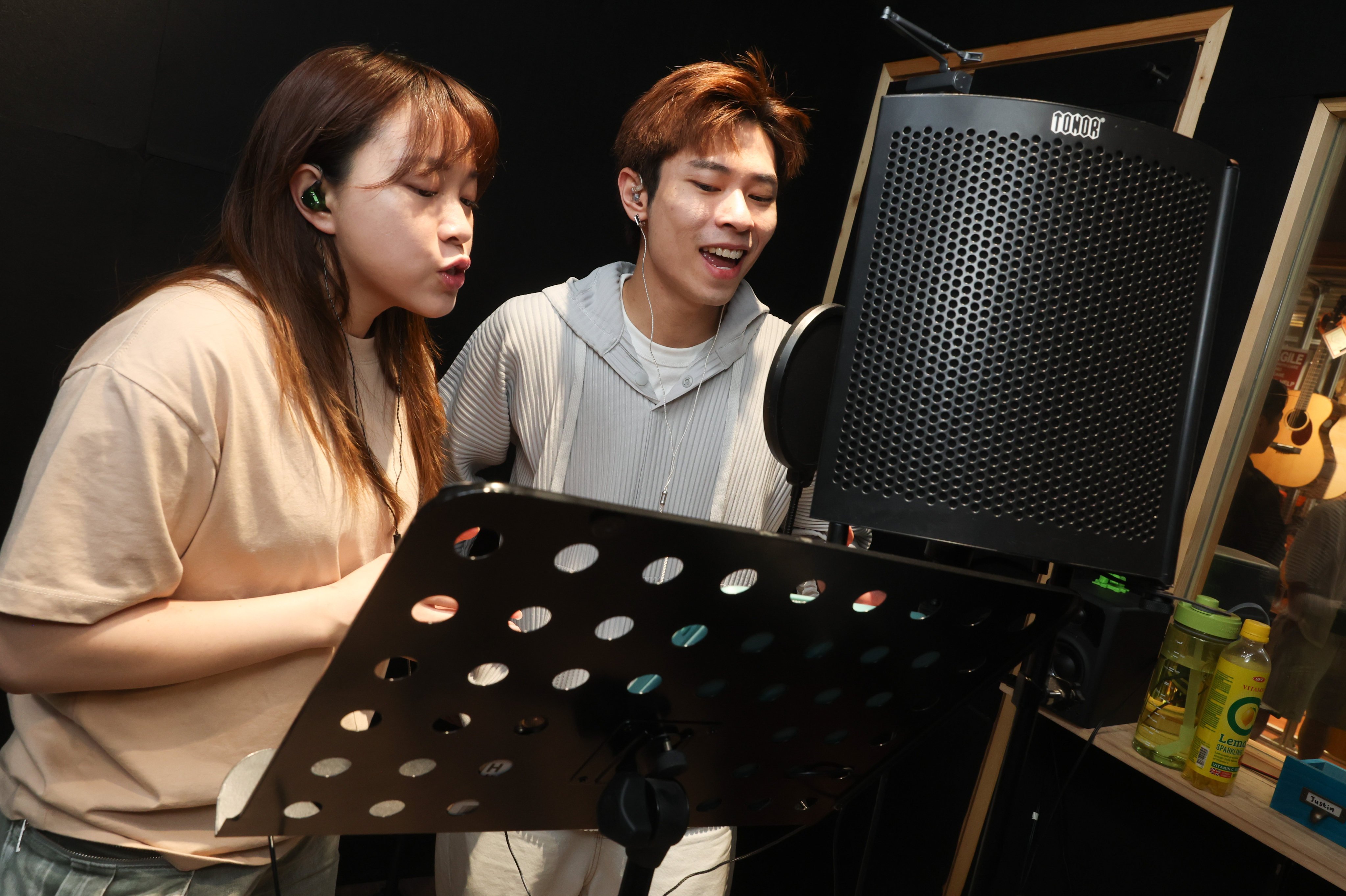 Singers Chloe Wong (left) and Marco Tang are part of the 17-person troupe responsible for “Wicked in Canto”, a series of videos featuring songs from the global musical phenomenon performed in Cantonese. Photo: Edmond So