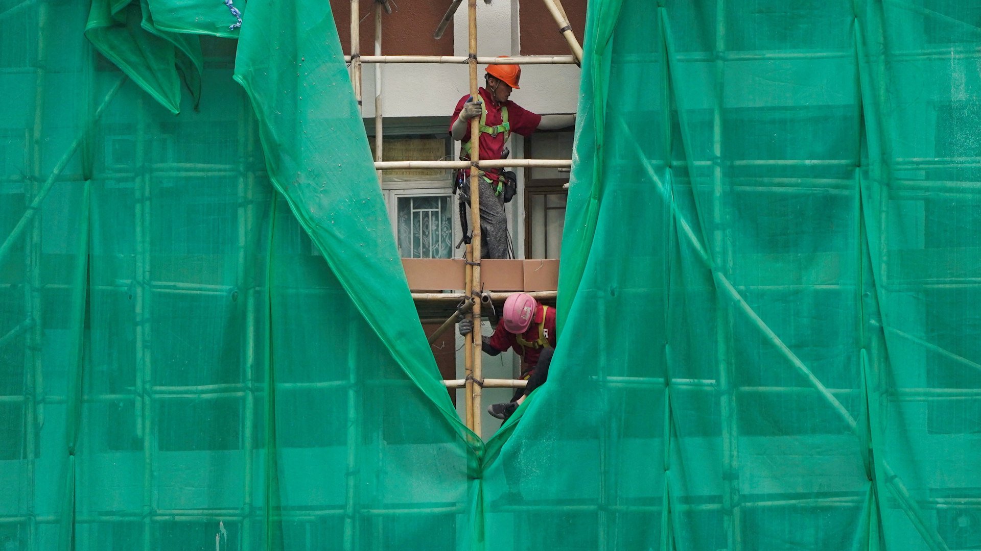 Hong Kong government orders scaffolding nets removed