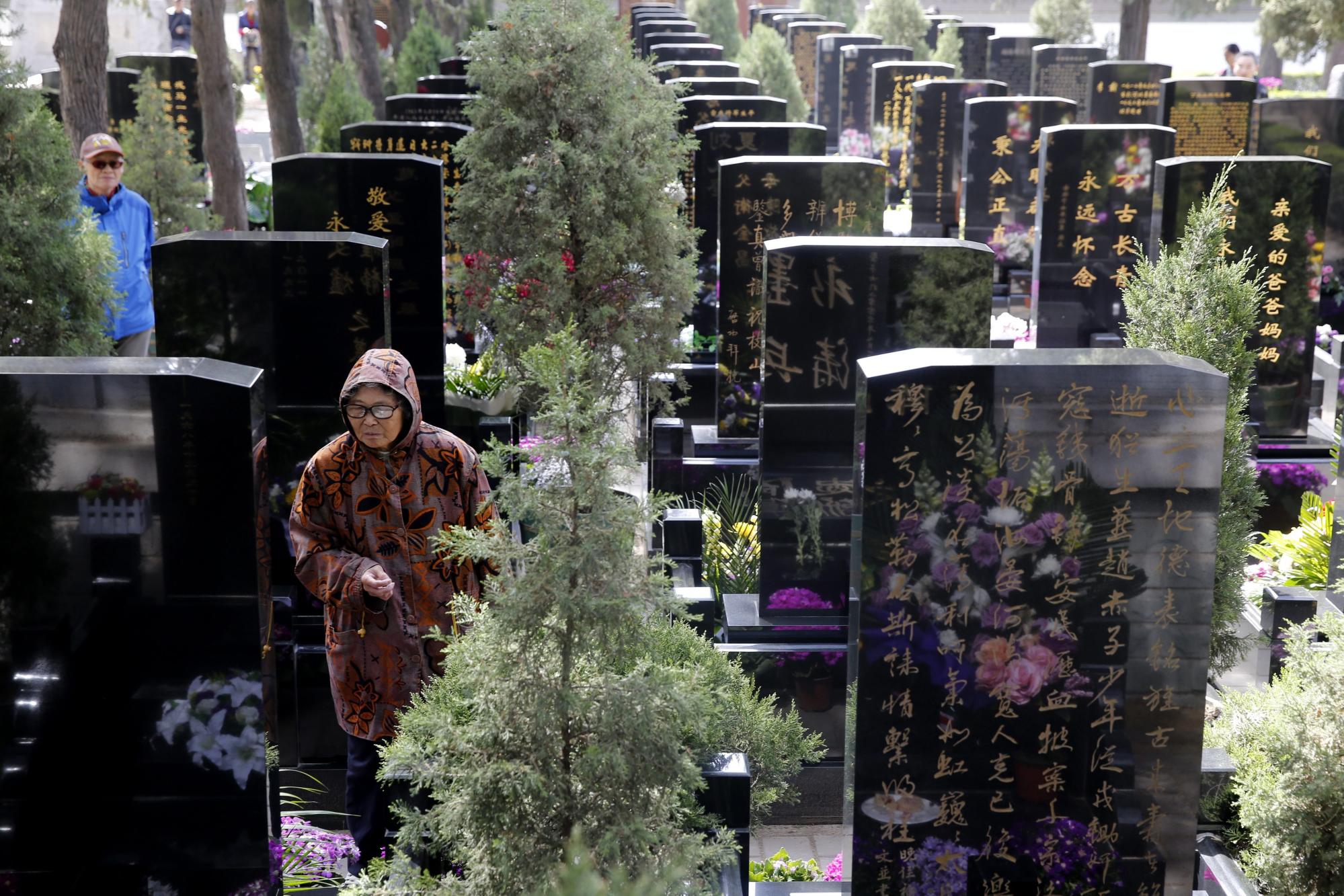 A gravesite in China. The son’s ritual is believed to help the dead arrive safely in the afterlife. Photo: EPA