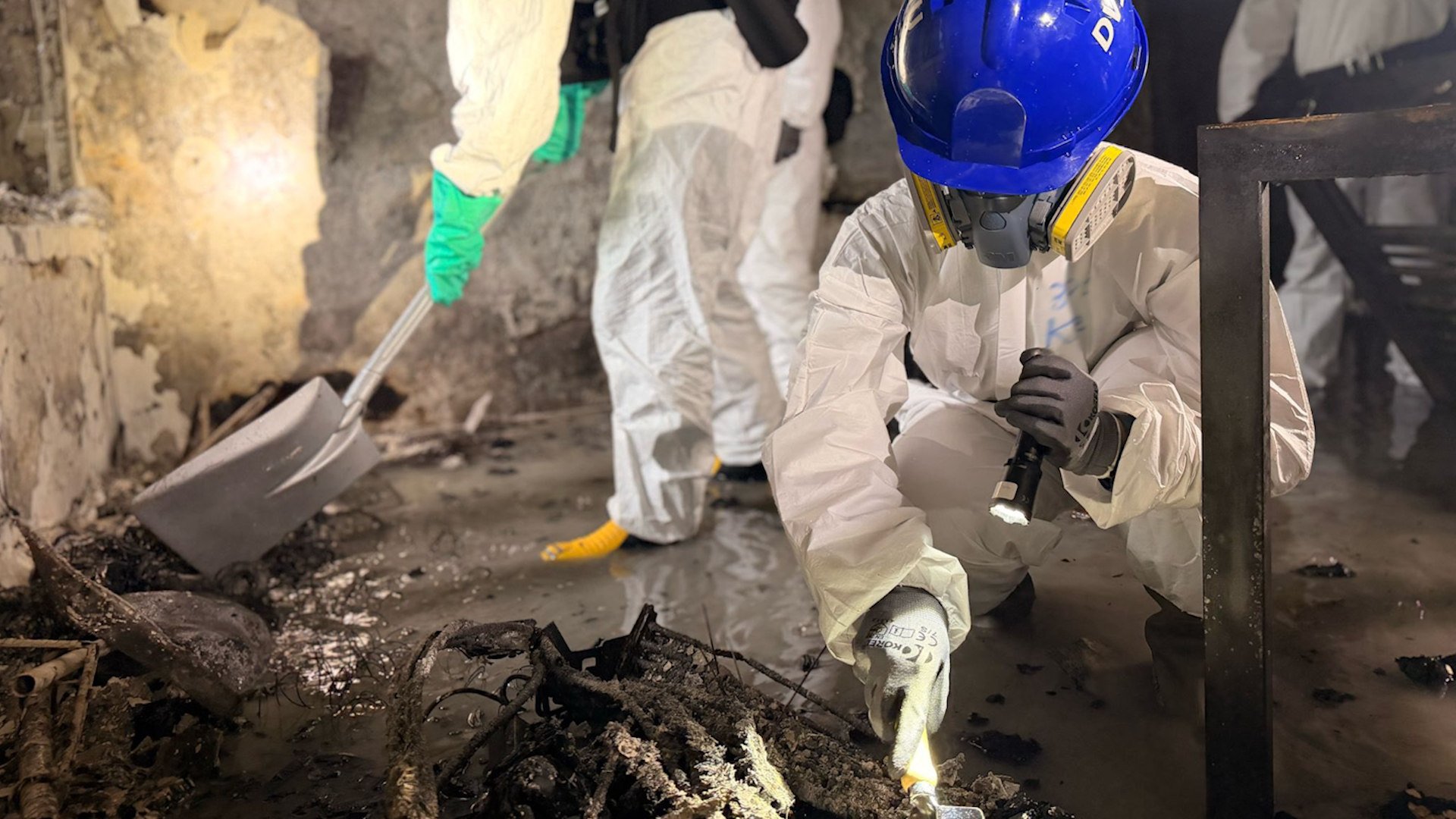 DVIU member searching at Wang Fuk Court fire site