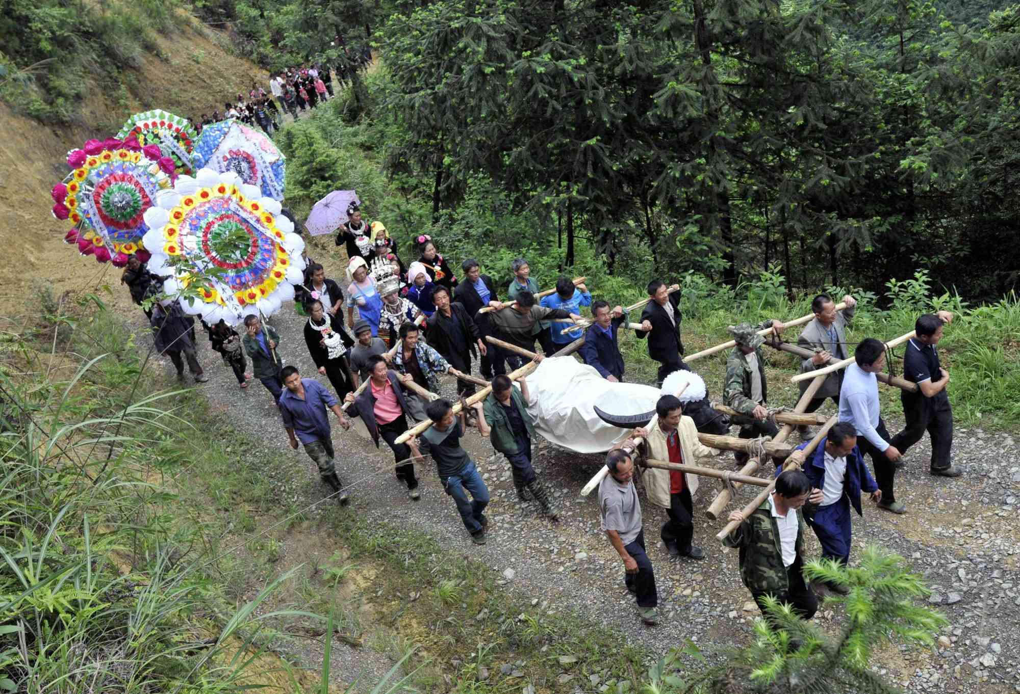 A funeral procession in China. The son was following a ritual called “pressing the ghost’s bed”. Photo: Reuters