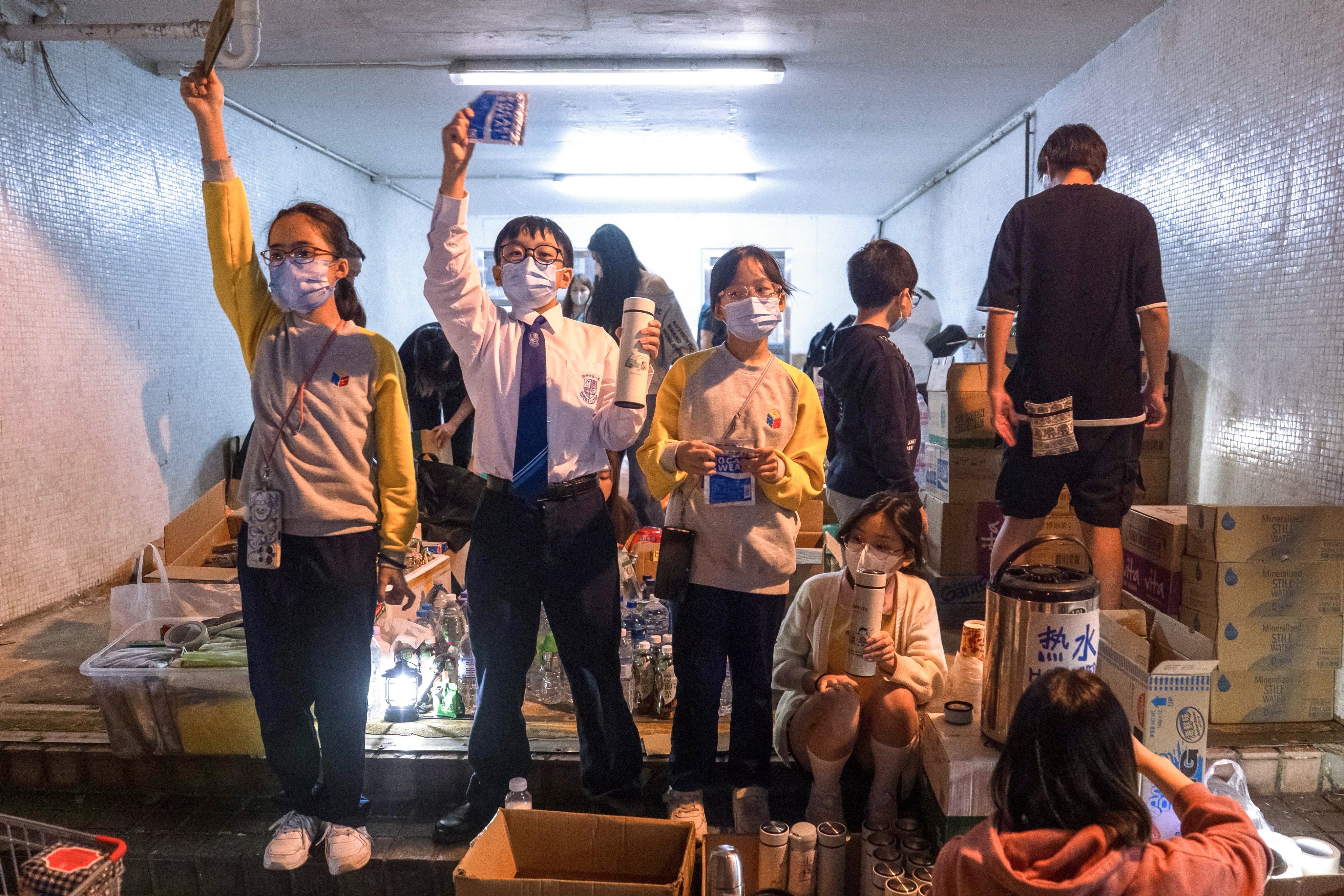 Student volunteers brought hot water, drinks and other supplies to people who had lost their homes to the fire at Wang Fuk Court. Photo: Elson Li