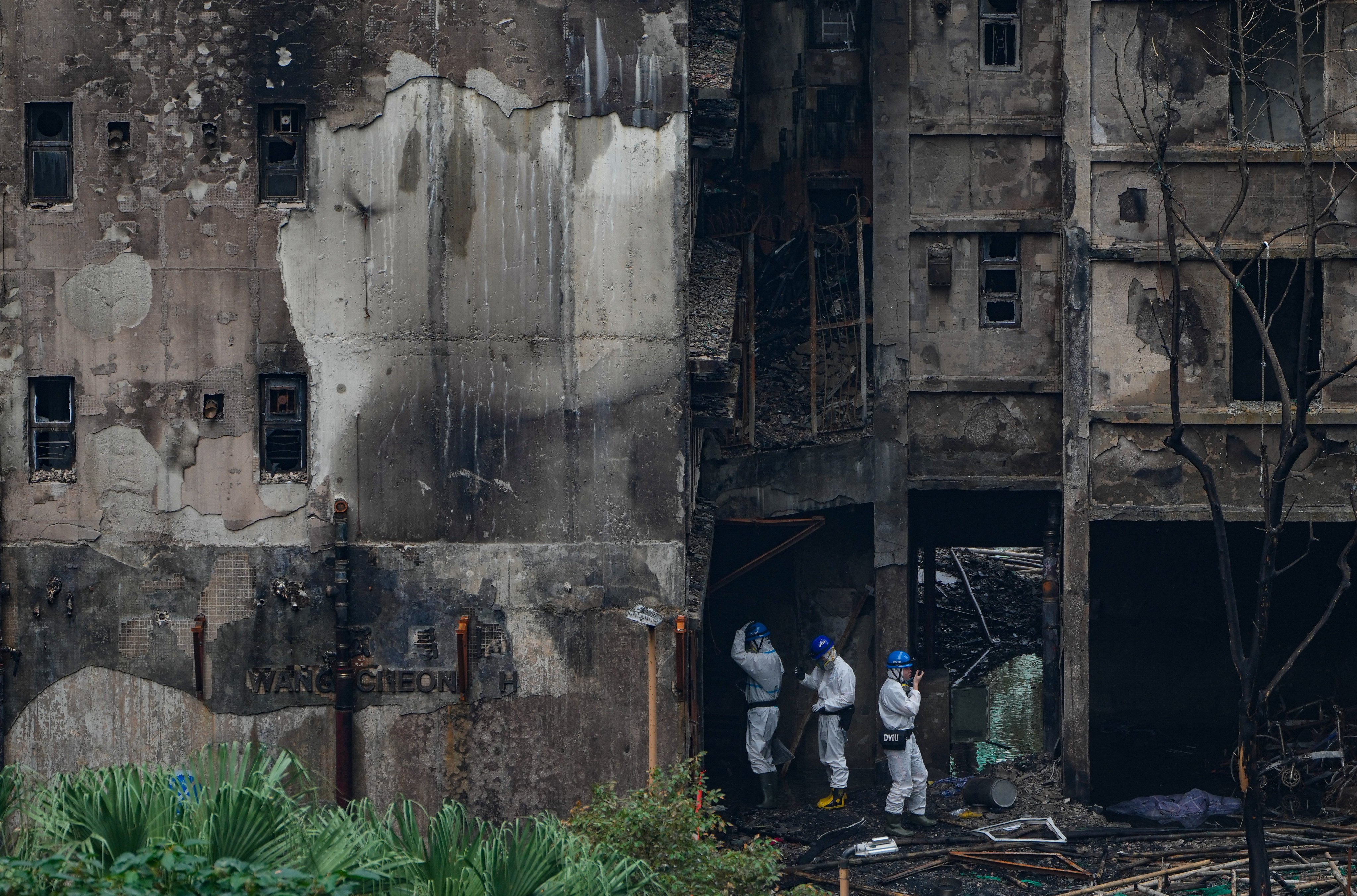 Members of the Disaster Victims Identification Unit work at the scene of the fire in Wang Fuk Court in Tai Po on December 3. Photo: Sam Tsang