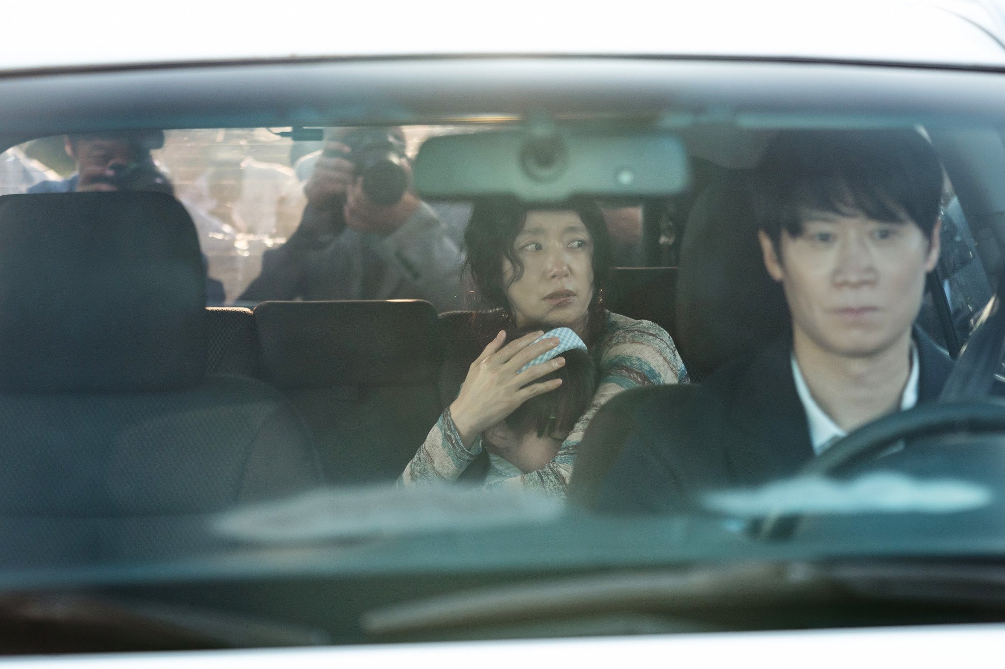 Jeon Do-yeon, left, as An Yun-su, an art teacher accused of murder, and Jin Sun-kyu as the lawyer Jang Jeong-gu in a still from 'The Price of Confession.' Courtesy of Netflix