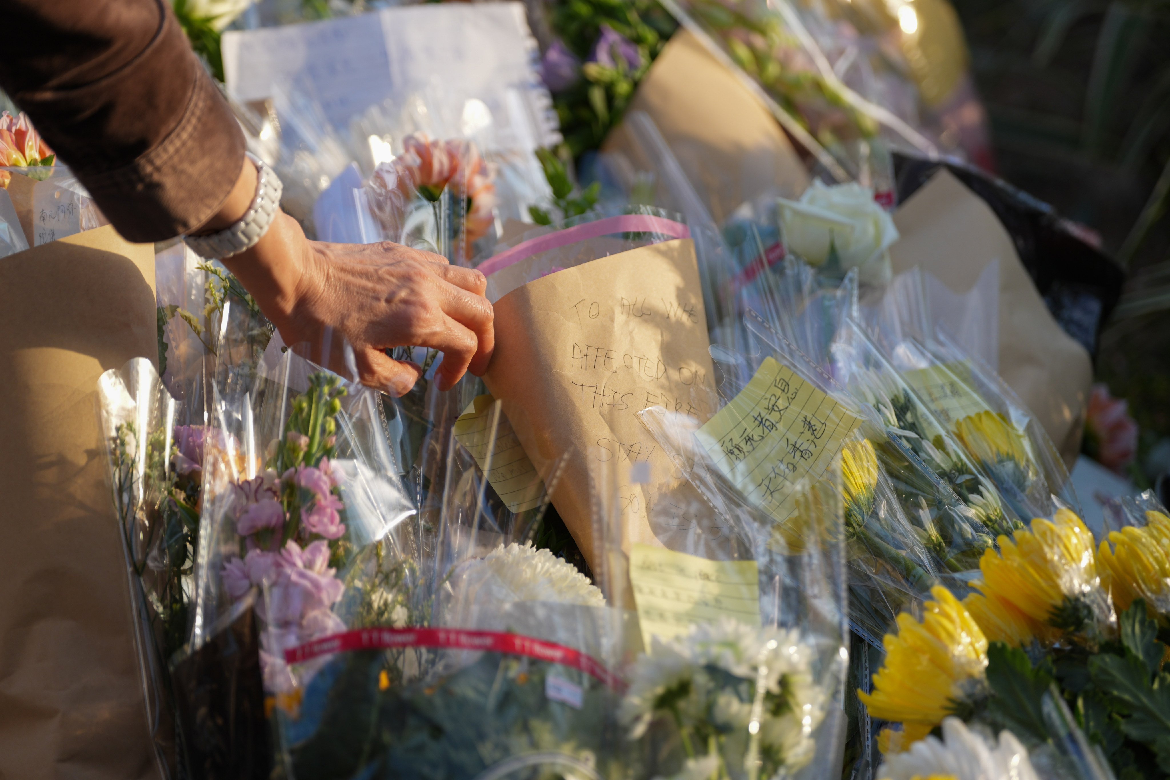 Hundreds of people have paid tributes to the victims of the fatal fire at Wang Fuk Court in Tai Po. Photo: Eugene Lee