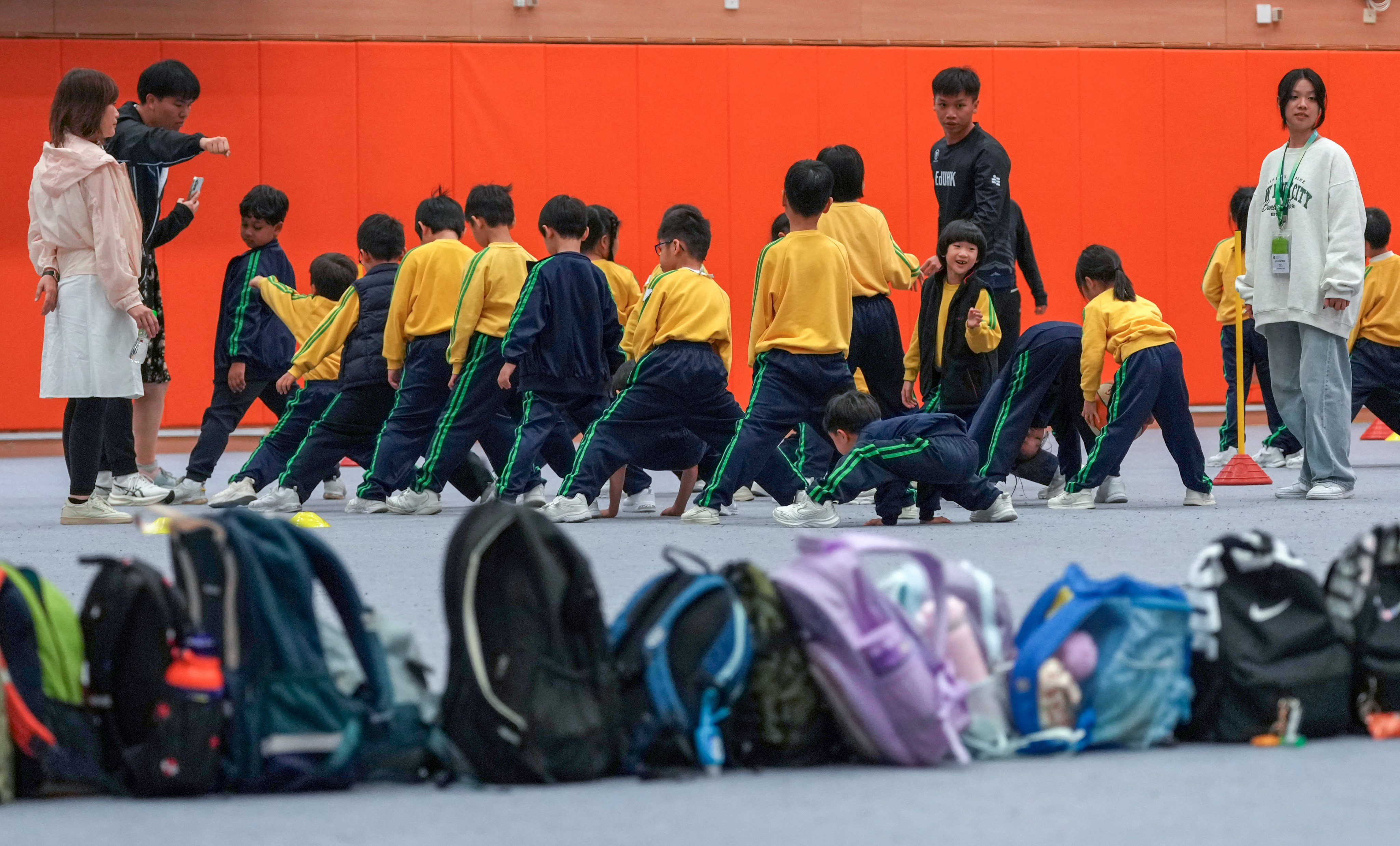 Tai Po Baptist Public School pupils enjoy a physical education class held in the Education University gymnasium. Photo: Jelly Tse