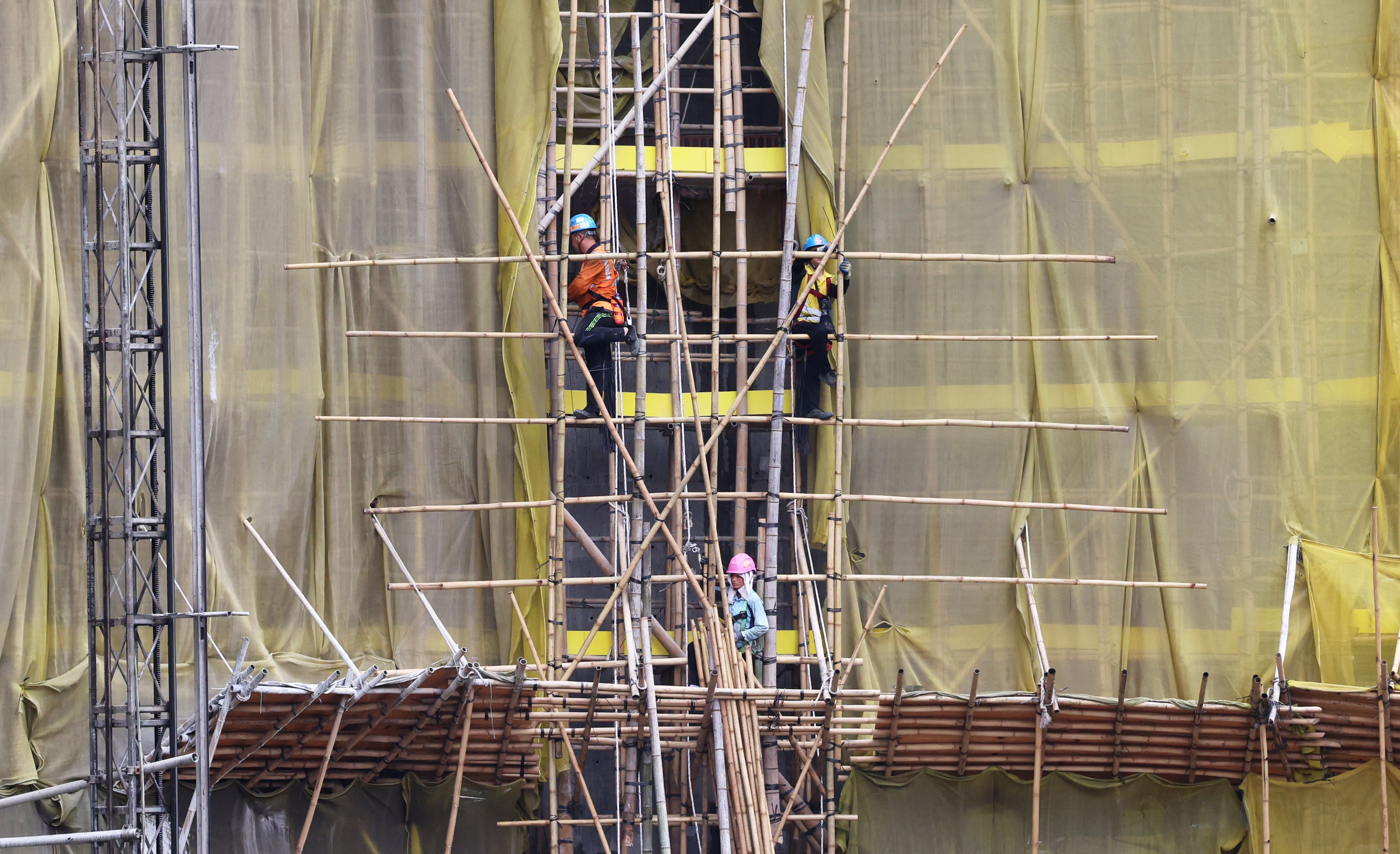 Workers at a construction site in Kai Tak. Photo: Jelly Tse