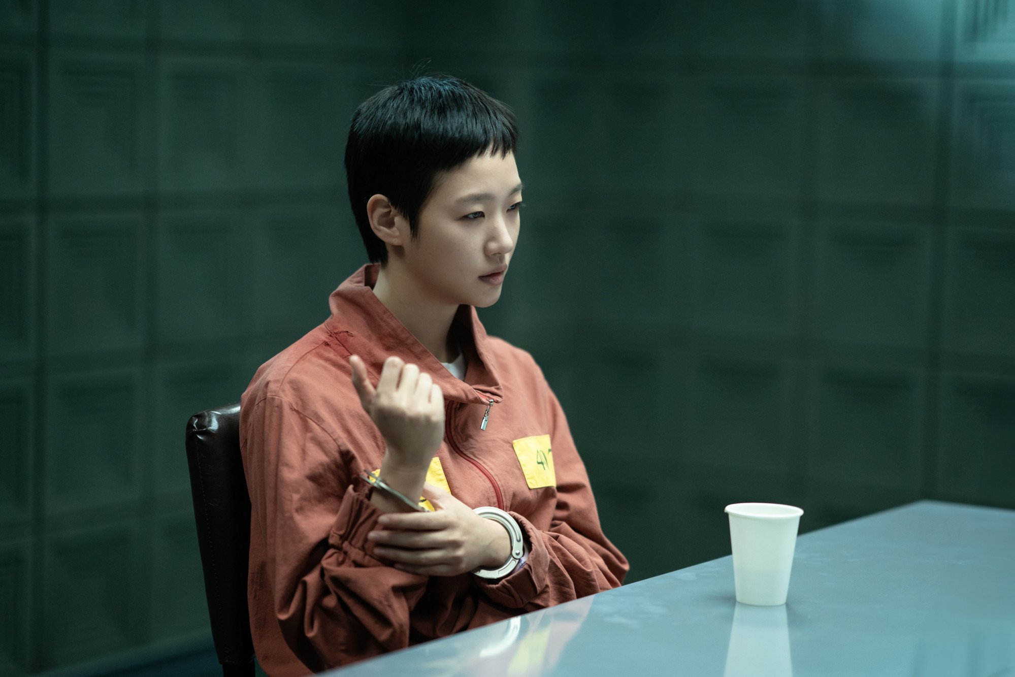 Kim Go-eun as accused poisoner Mo-eun in a still from 'The Price of Confession.' Courtesy of Netflix