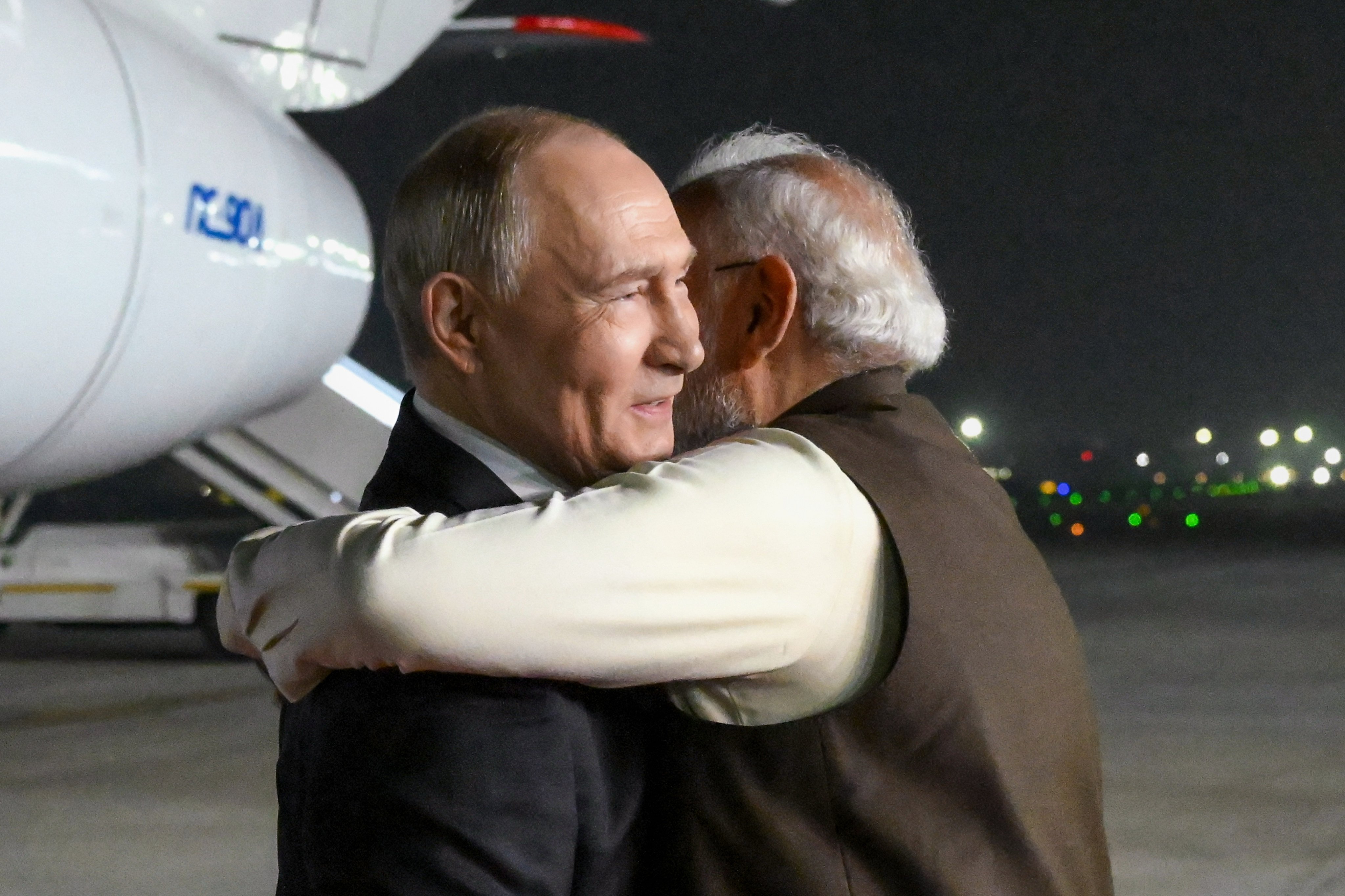 Russian President Vladimir Putin (left) and Indian Prime Minister Narendra Modi embrace at the Palam Air Base in New Delhi on Thursday. Photo: Sputnik/Kremlin/AP
