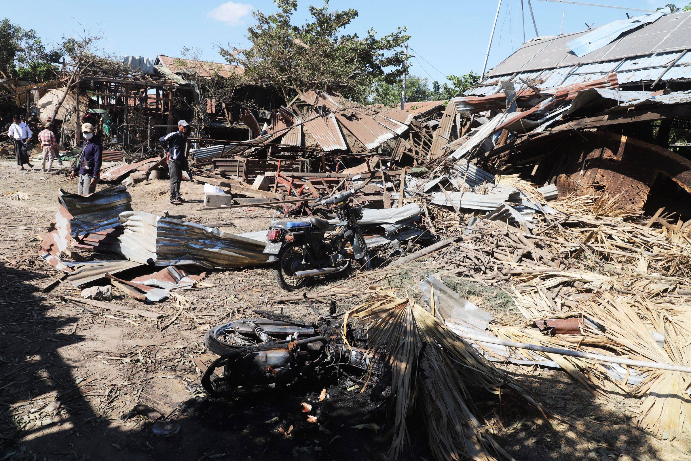 People inspect their damaged home after bombardments carried out by Myanmar’s military in Tabayin, in Myanmar’s Sagaing region, on Saturday. Photo: AFP