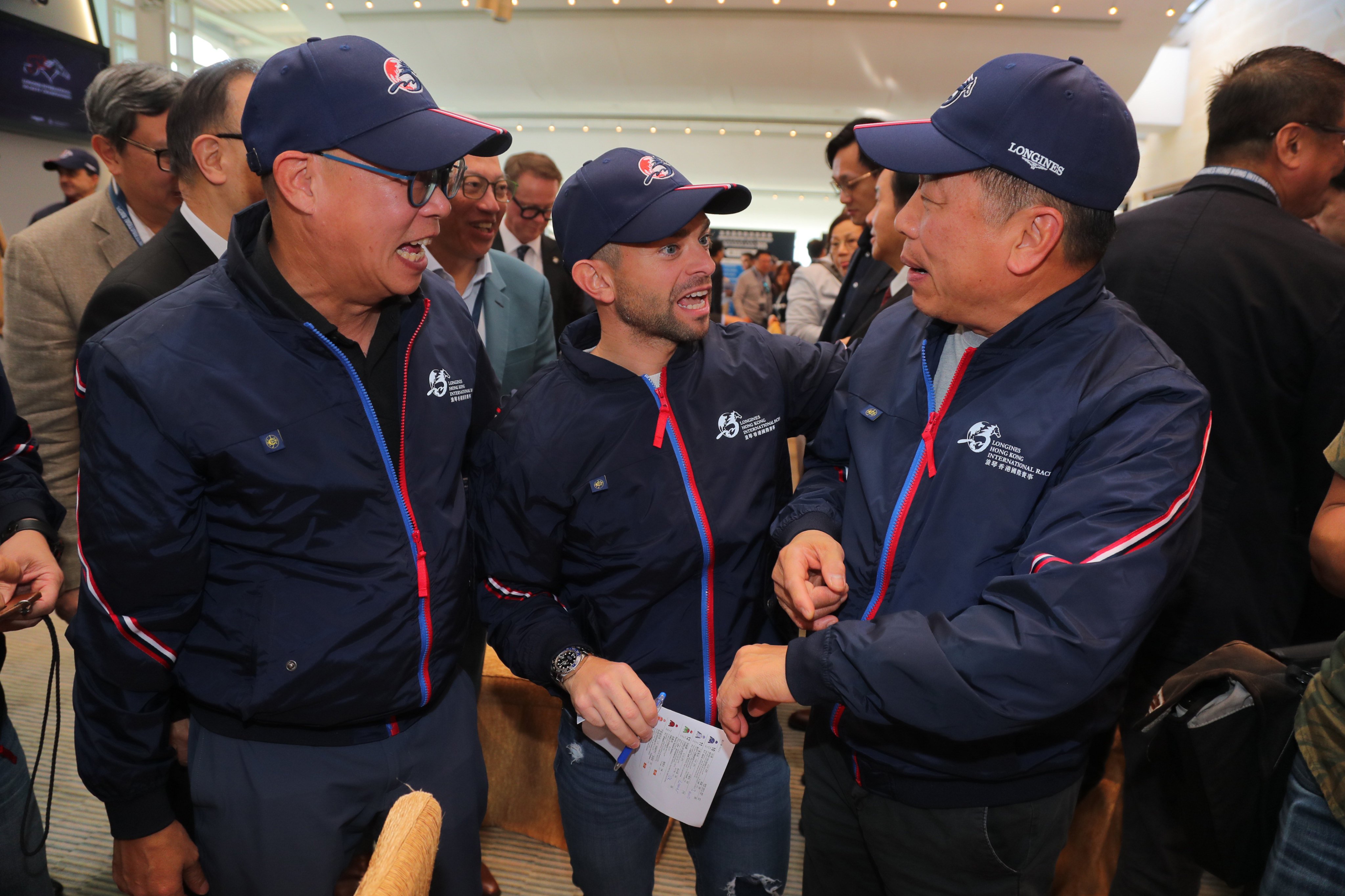 Jockey Umberto Rispoli (centre) with trainers Chris So (left) and Ricky Yiu at the International Jockeys’ Championship draw on Monday morning. Photos: Kenneth Chan