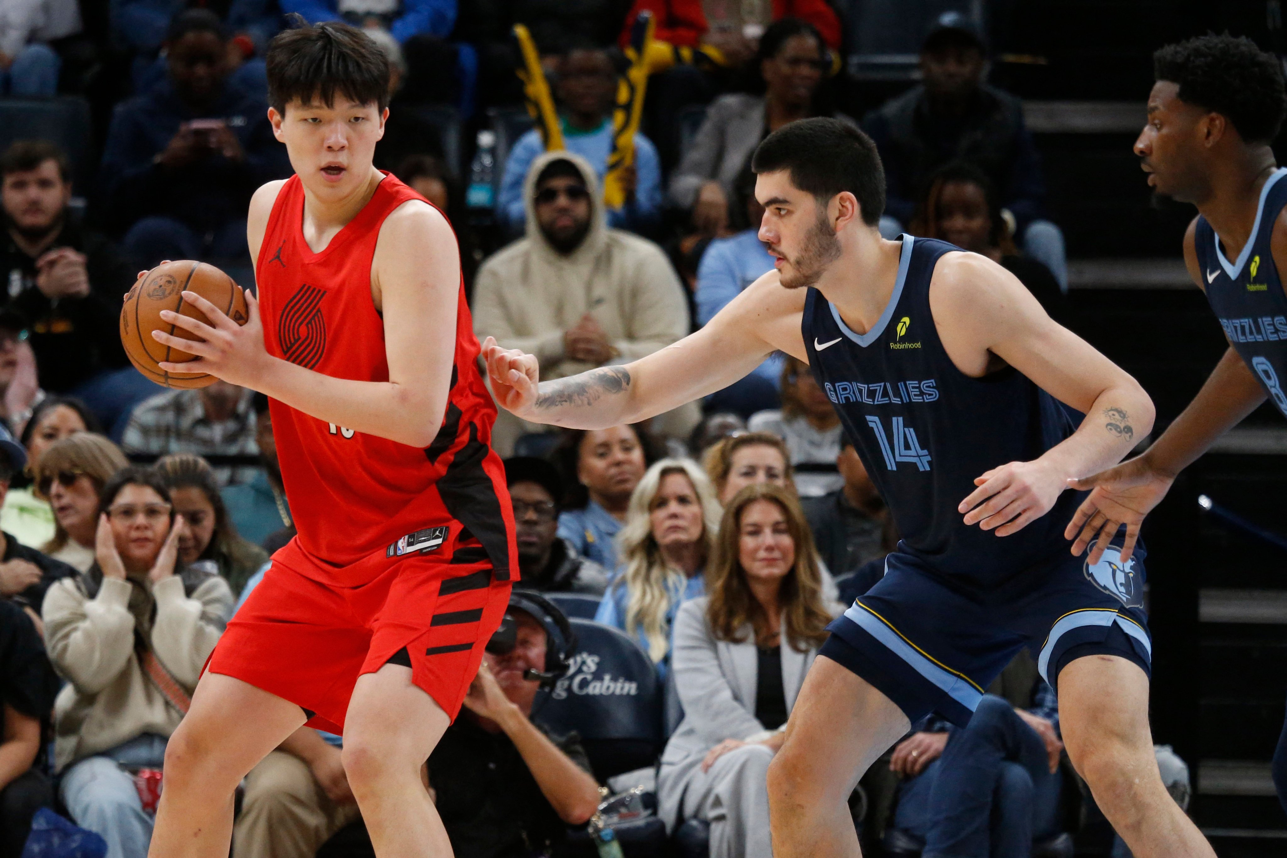 Yang Hansen (left) in action for Portland Trail Blazers in Memphis. Photo: Imagn Images via Reuters Connect