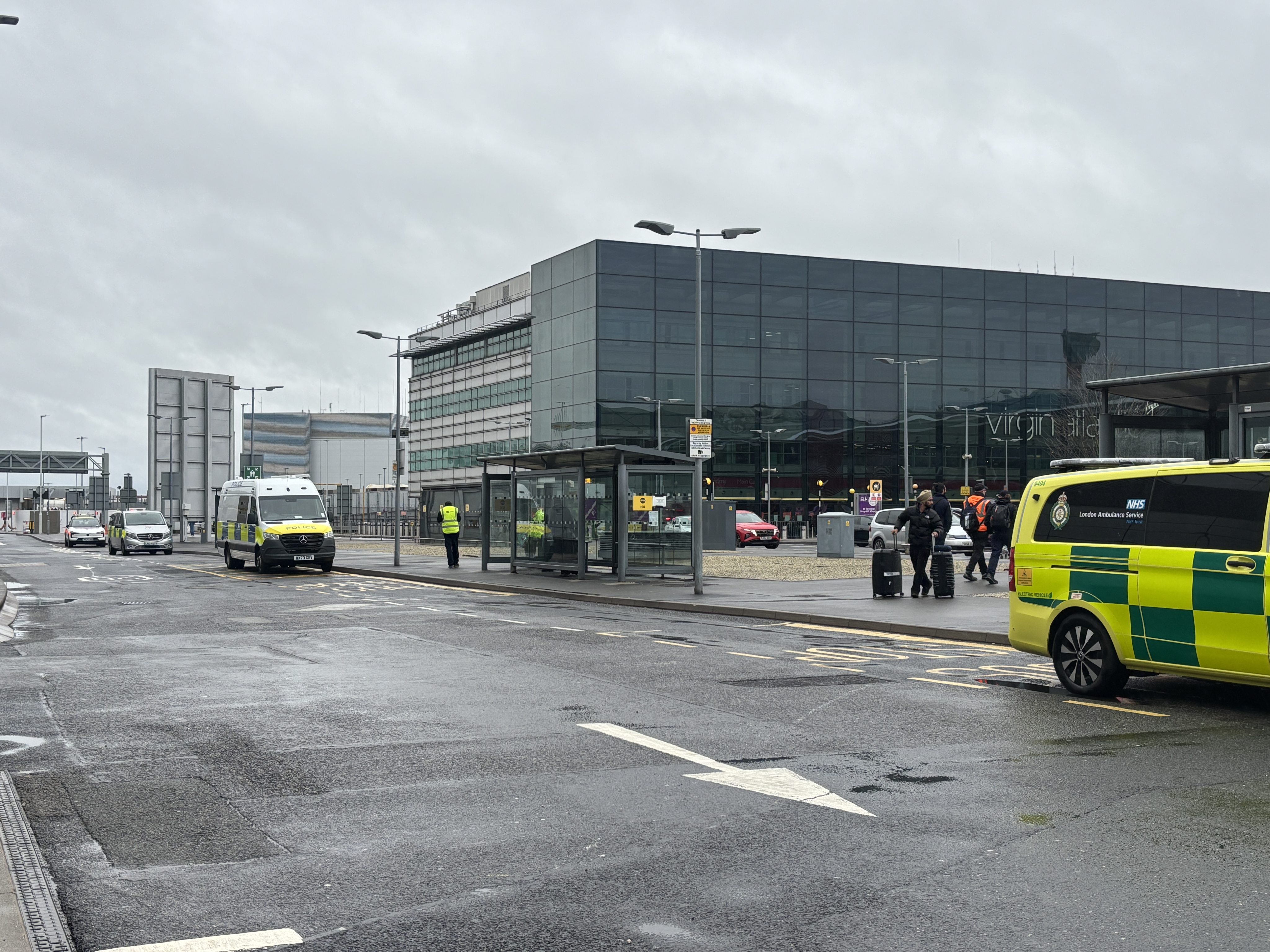 Emergency vehicles outside Heathrow Airport Terminal 3. A man was arrested on Sunday on suspicion of assault after a number of people were attacked with “a form of pepper spray” by a group of men. Photo: PA Wire / dpa