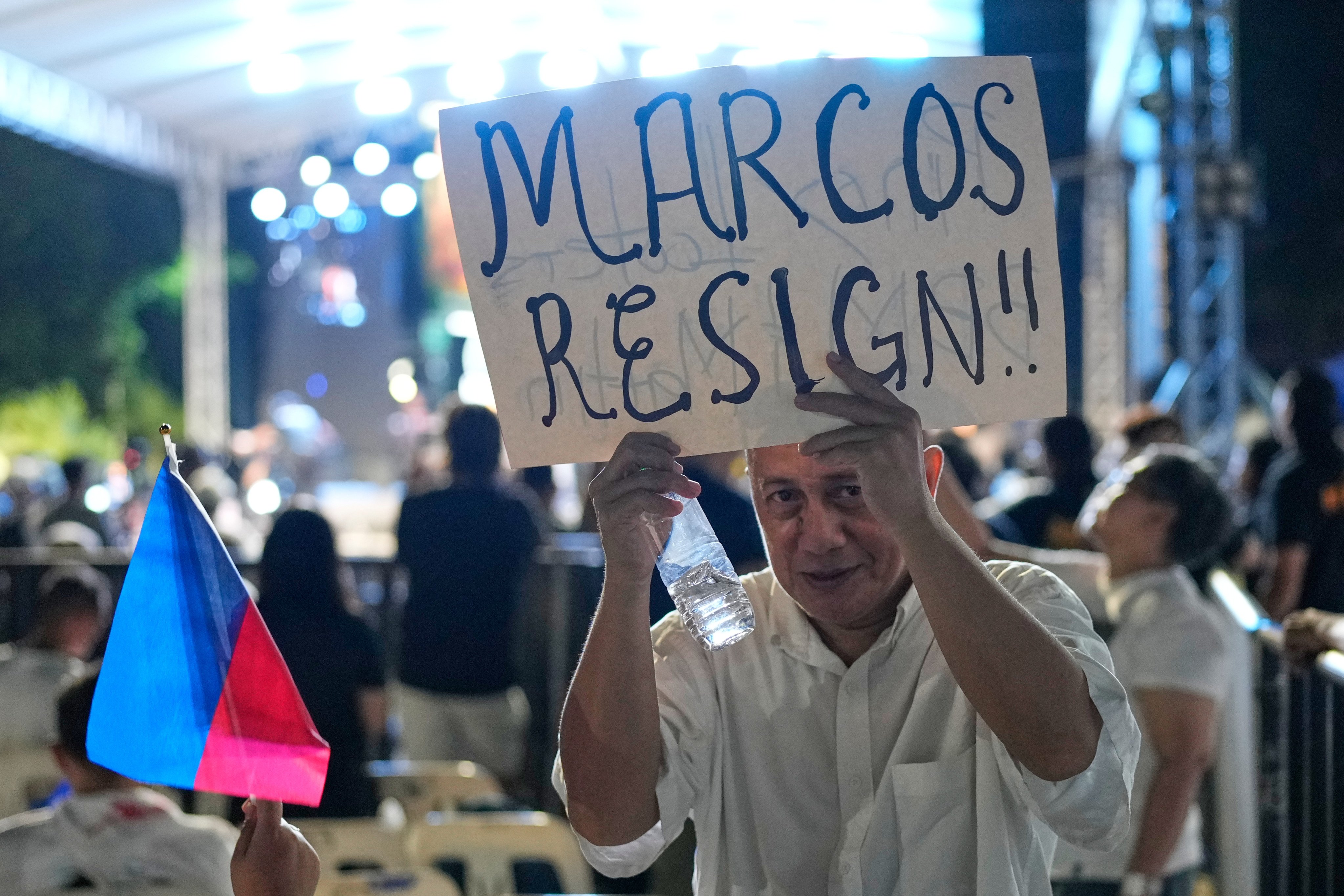 A protester holds a slogan during an anti-corruption rally in Quezon City on November 16. Philippine President Ferdinand Marcos’ satisfaction ratings fell to 21 per cent in November – his steepest decline since February this year. Photo: AP