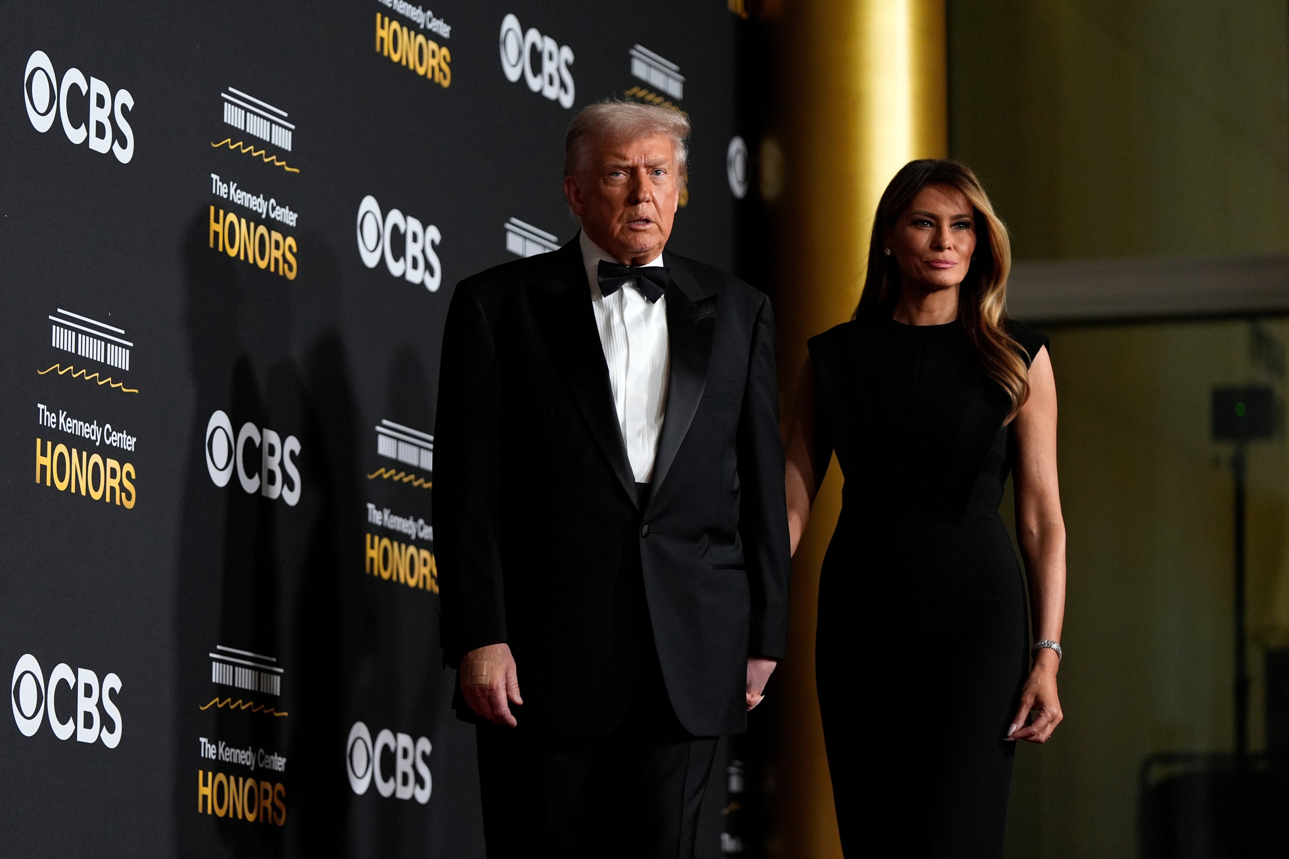 US President Donald Trump and first lady Melania Trump walk the red carpet. Photo: AP