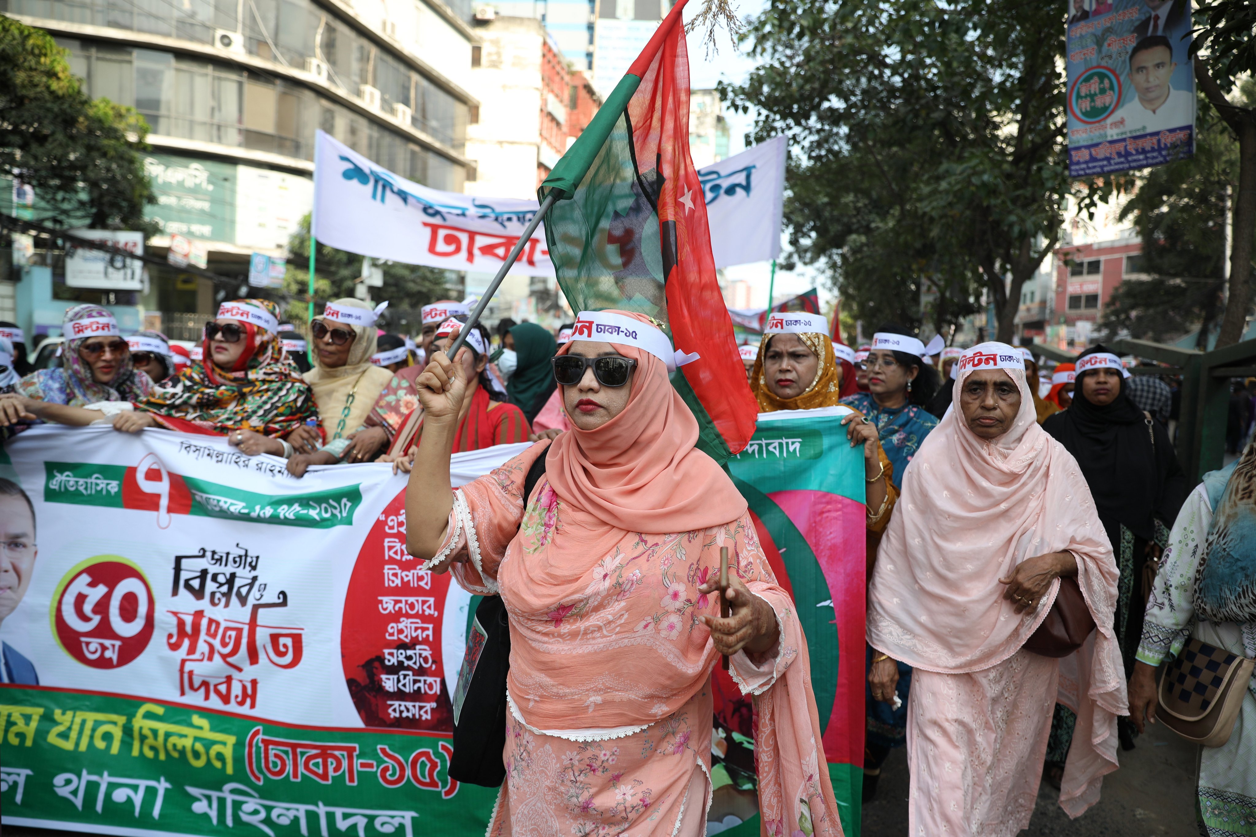 People carry flags and banners during a rally organised by the Bangladesh Nationalist Party in Dhaka, Bangladesh, on November 7. Photo: EPA