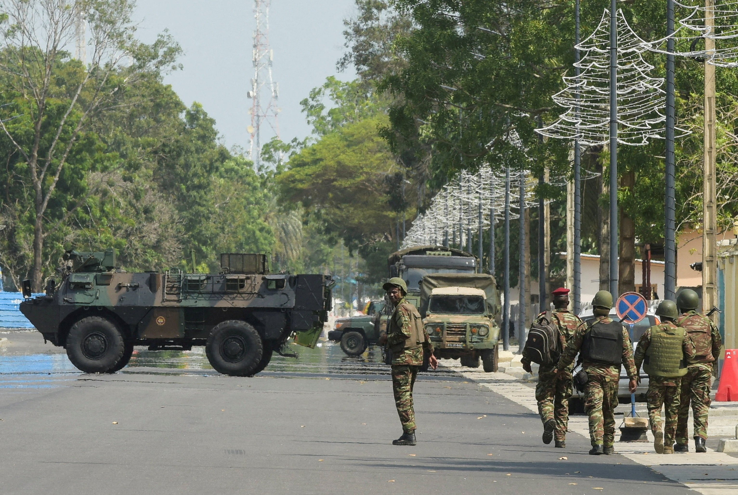 Soldiers patrol in front of the headquarters of Benin’s radio and television station after the country’s armed forces thwarted the attempted coup. Photo: Reuters