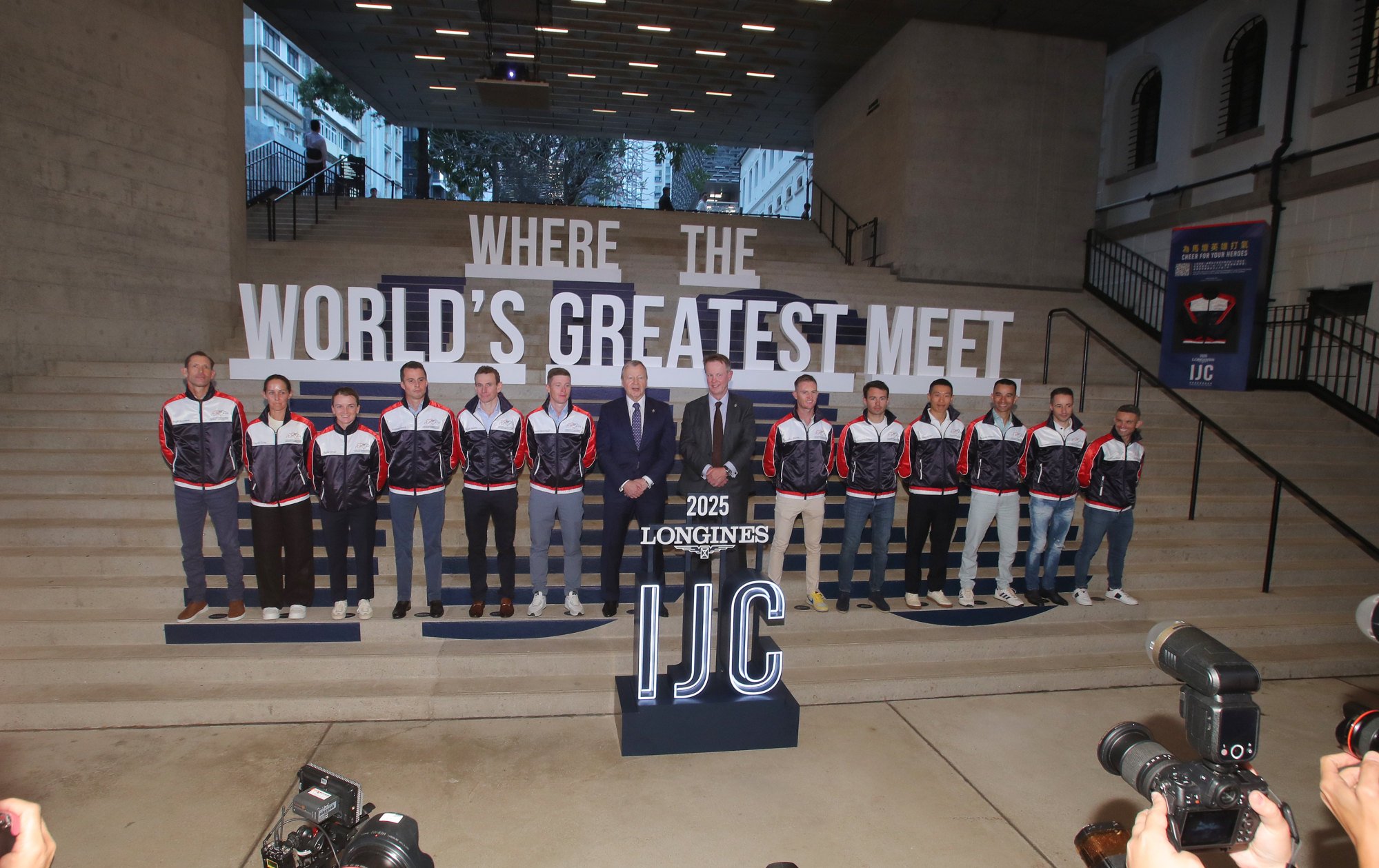 Jockeys and officials pose for a photo at Wednesday night’s IJC press conference at Tai Kwun.