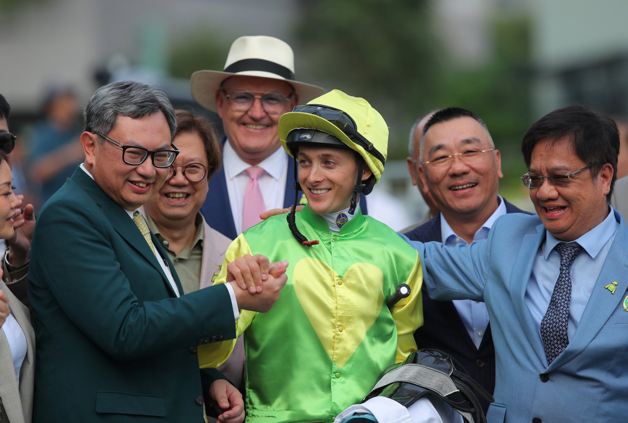 Trainer David Hayes (background), jockey Harry Bentley and connections of Tomodachi Kokoroe celebrate his Premier Bowl victory. Photo: Kenneth Chan