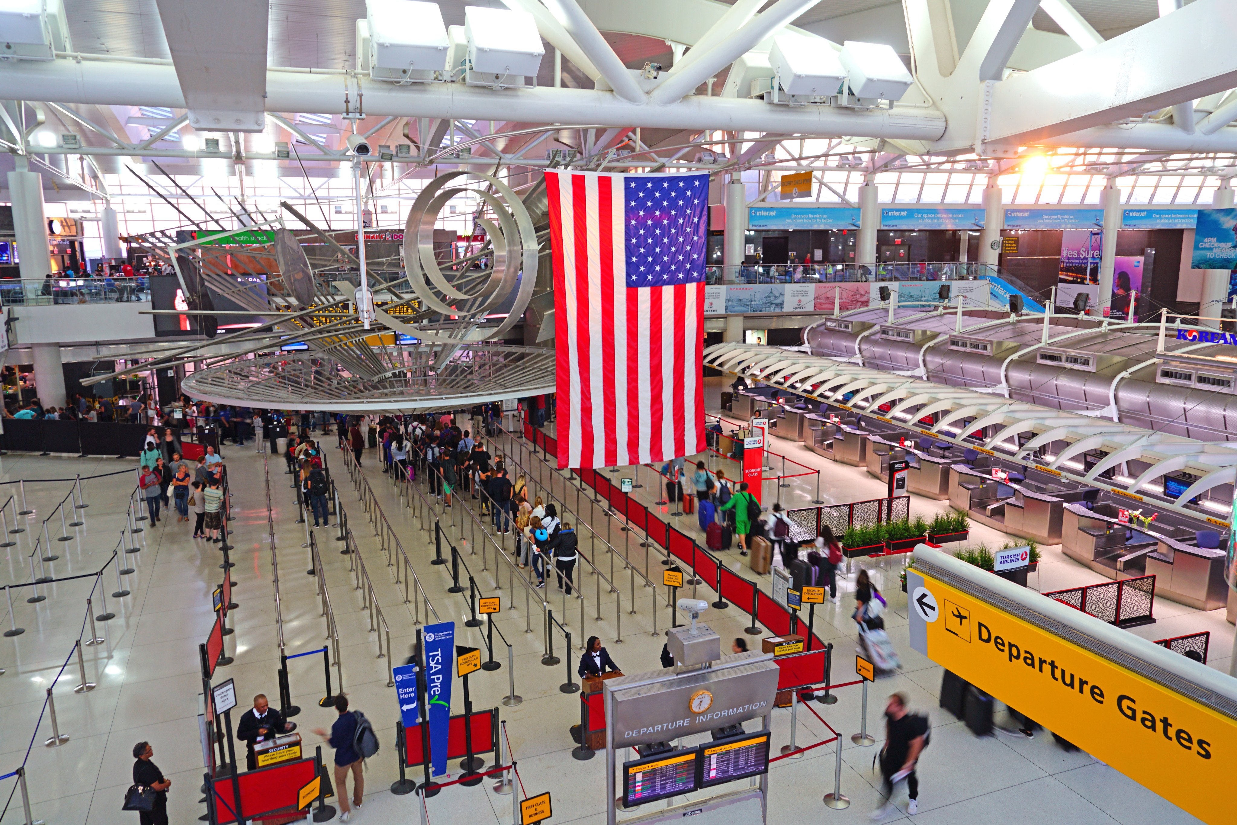 View of a giant American flag inside Terminal 1 at JFK airport in New York. Photo: Shutterstock