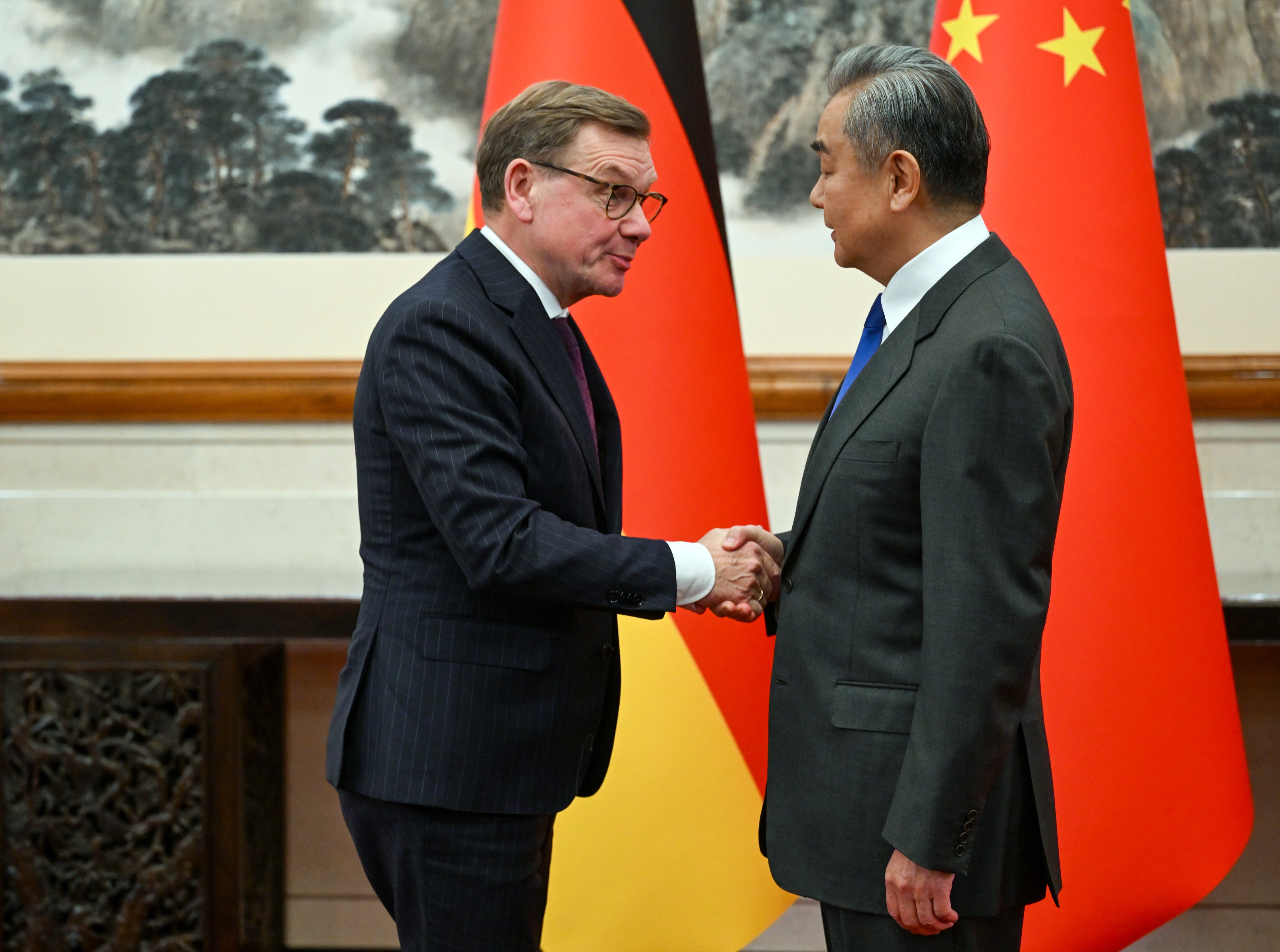 German Foreign Minister Johann Wadephul, left, and Chinese Foreign Minister Wang Yi greet each other before their talks in Beijing on December 8. Photo: dpa