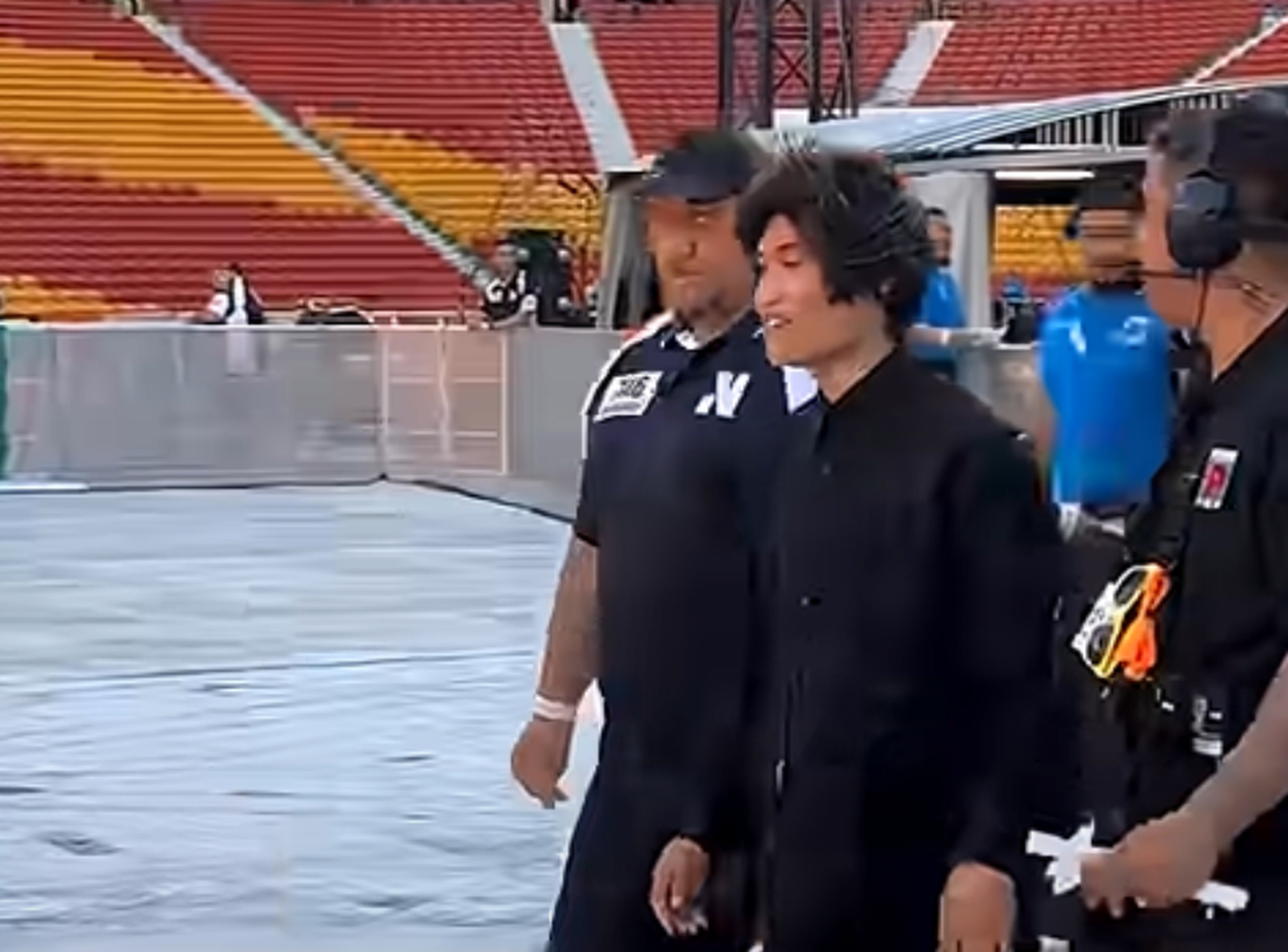 Johnson Wen is seen being escorted out of a concert venue in Brisbane, Australia. Photo: Handout