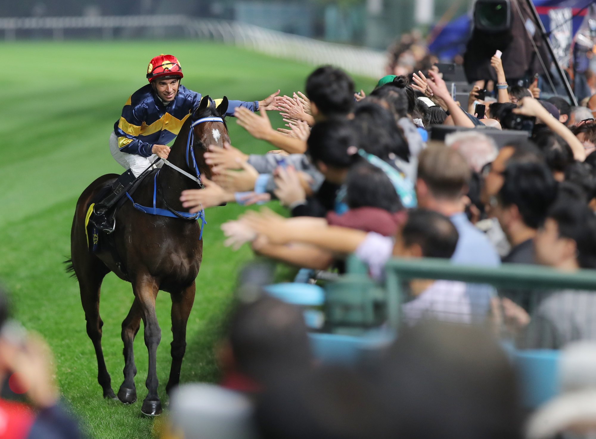 Joao Moreira takes the acclaim of the Happy Valley crowd. Joao Moreira takes the acclaim of the Happy Valley crowd.